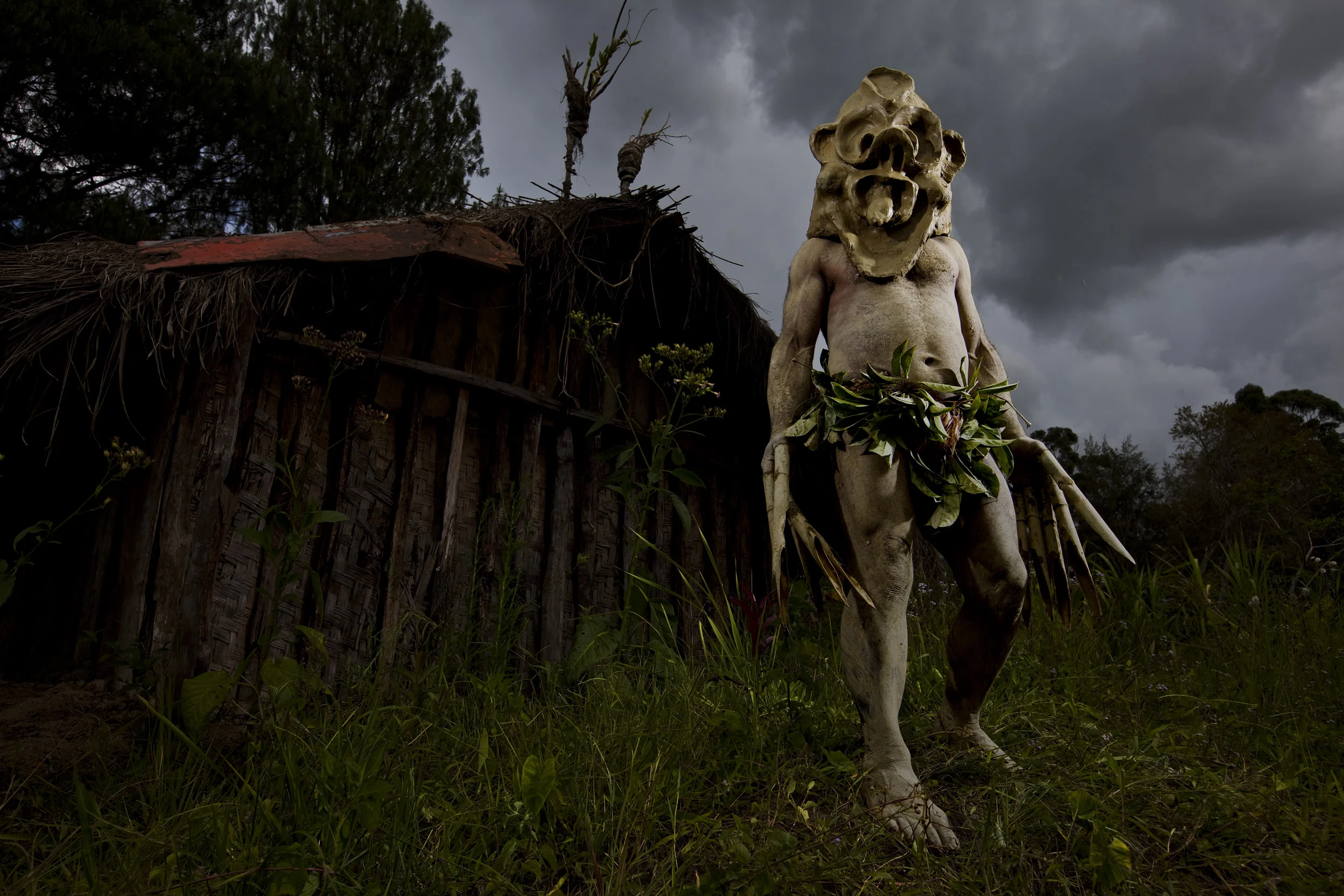MINDIMA VILLAGE, CHIMBU PROVINCE, HIGHLANDS, PAPUA NEW GUINEA-DECEMBER 2008: Images of traditional "Mud-Men" in a village in Chimbu Province, Highlands, Papua New Guinea, 18 December 2008. "Mud-Men" are originally thought to have originated from a