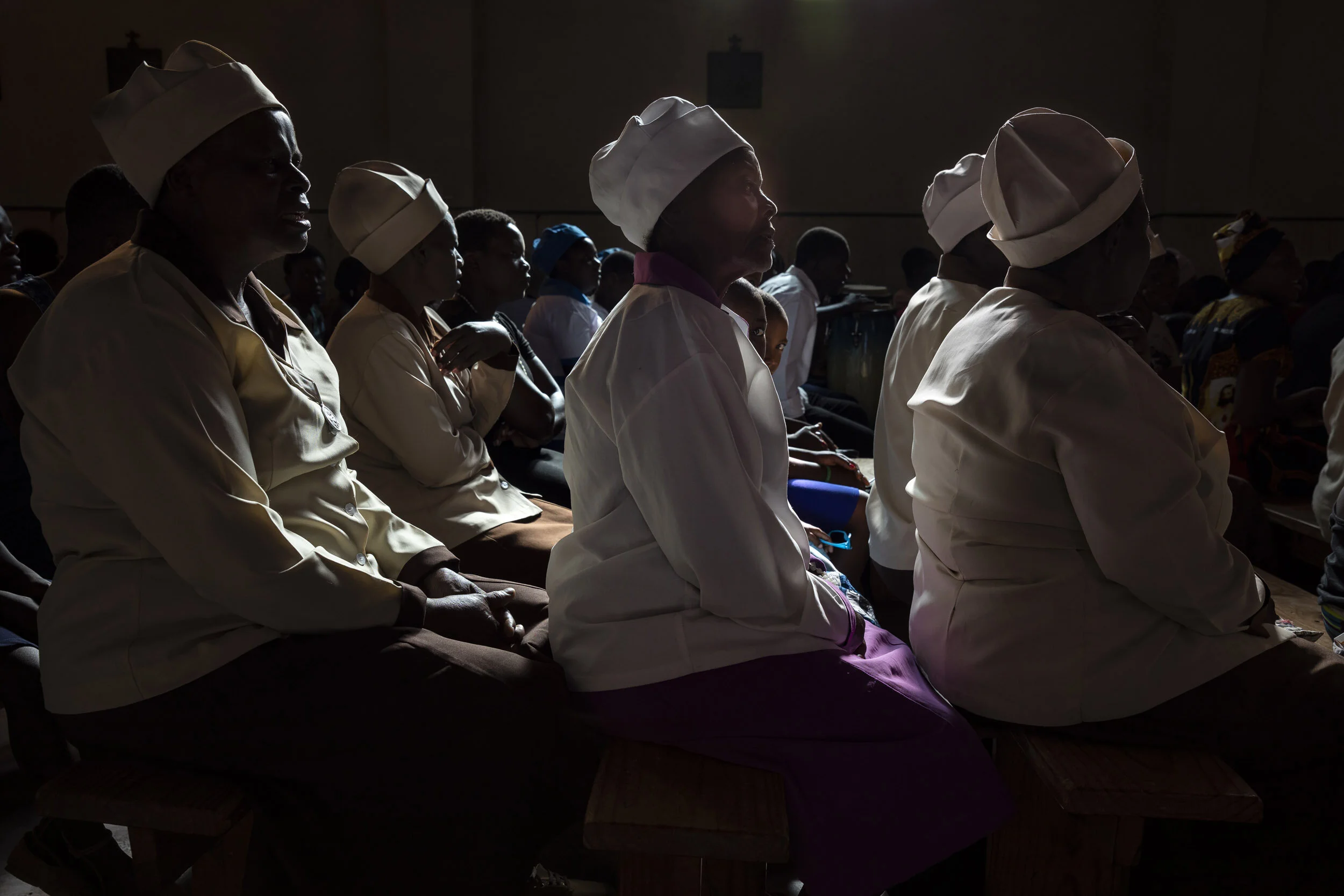 MSVINGO, ZIMBABWE, 23 JANUARY 2020: Grandmothers who are Friendship Bench counsellors attend sunday service at the Catholic Church in Msvingo. Friendship Benches likes to partner with the church in offering support to their patients. Friendship Benc