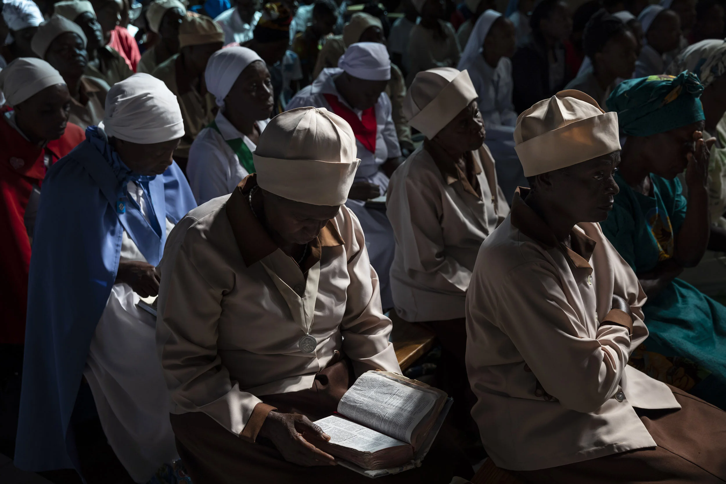 MSVINGO, ZIMBABWE, 23 JANUARY 2020: Grandmothers who are Friendship Bench counsellors attend sunday service at the Catholic Church in Msvingo. Friendship Benches likes to partner with the church in offering support to their patients. Friendship Benc