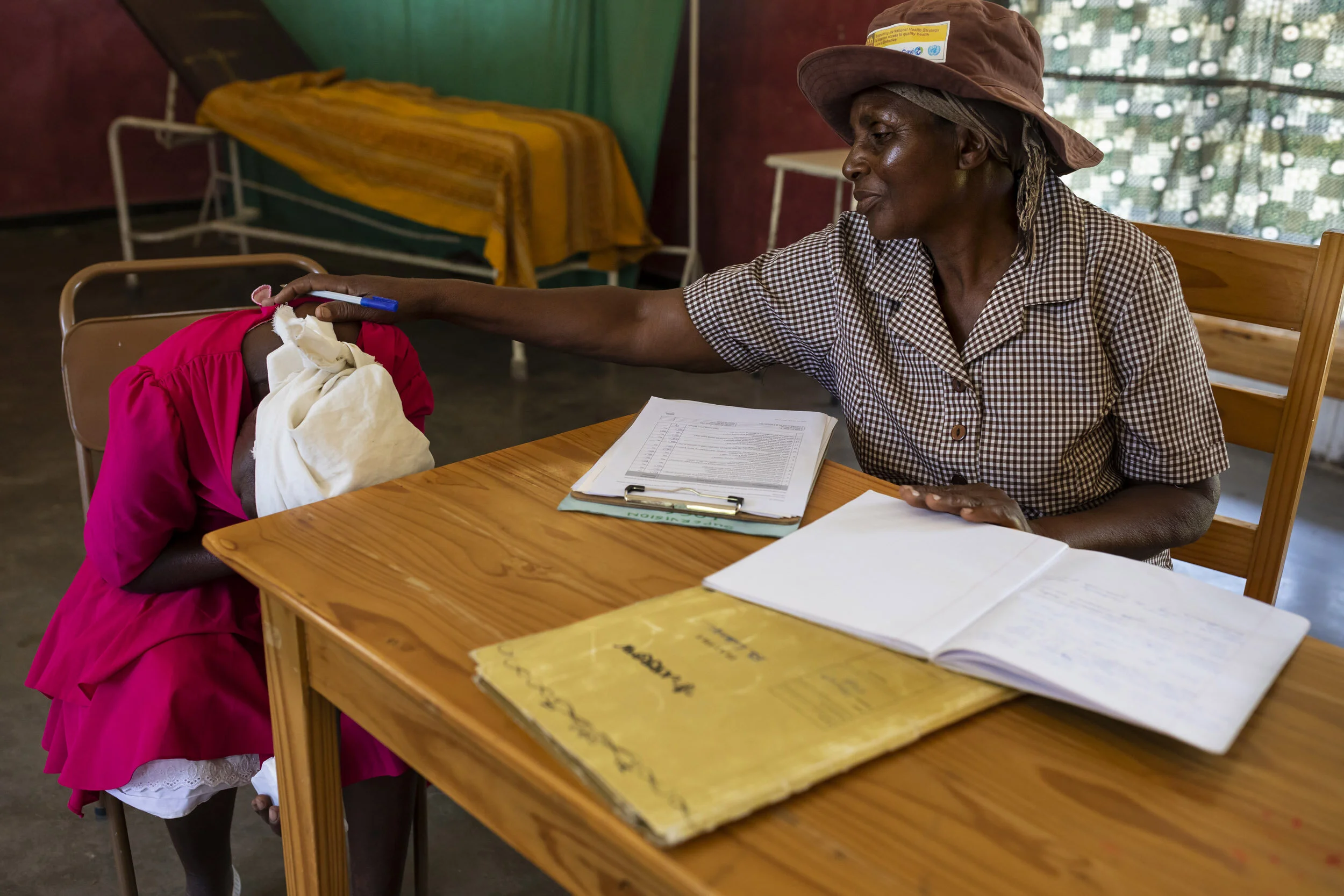 ZAKA, MSVINGO, ZIMBABWE, 23 JANUARY 2020: Grandmother and Friendship Bench counsellor Aleta Gukwa, 60, is seen with a new patient Apolonia Mekadha, 58. Friendship Benches is an NGO that offers free mental health counselling through trained grandmot