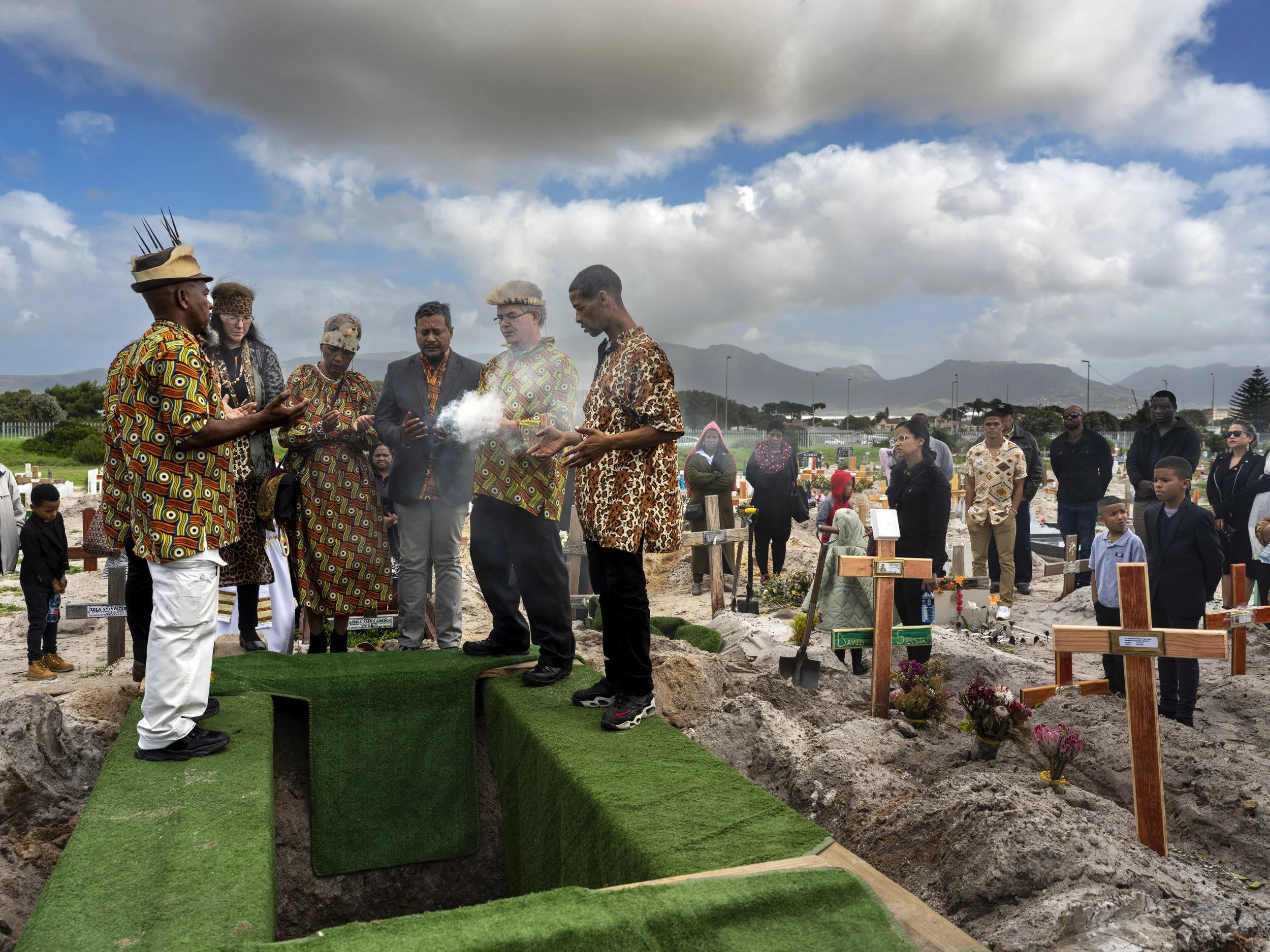 GRASSY PARK, CAPE FLATS, SOUTH AFRICA: The funeral of Desmond Charles Dreyer, a leader in the Goringhaicona Khoi Khoin Indigenous tribal council. Other members of the council are seen graveside burning herbs in a traditional ceremony to commemorate