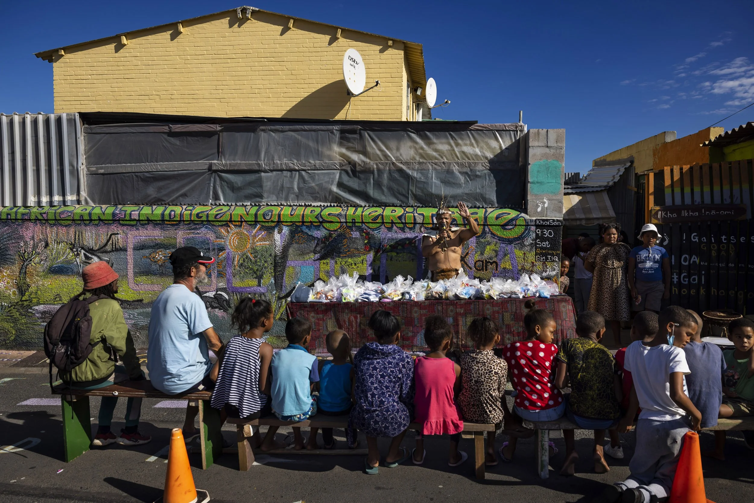 OCEANVIEW, CAPE TOWN SOUTH AFRICA, MARCH 12, 2022: Chief Bi’a Ishsaqua Sabodien is seen educating children and youth in Oceanview township about their Khoi first people’s heritage. His children are seen wearing leopard print dresses. Chief Ishsaqua