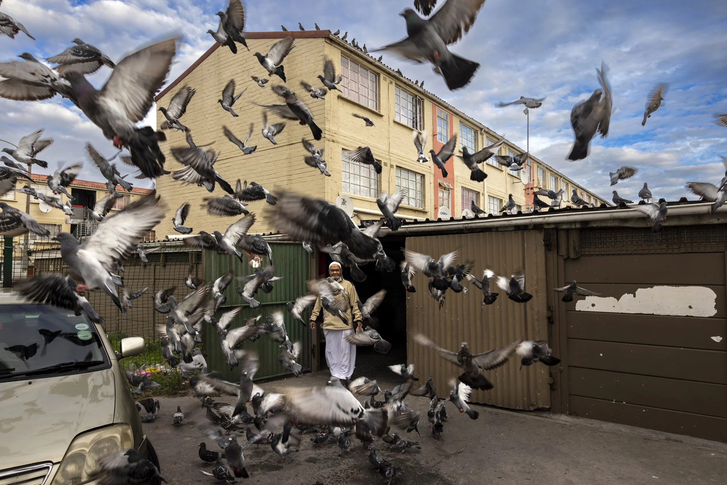 HANOVER PARK, CAPE TOWN, SOUTH AFRICA: Sahid Mohammed feeds pigeons in a dangerous part of Hanover Park, one of the most dangerous gang areas in South Africa and a hotbed of drug use and violence. Hanover Park has seen over 16000 gunshots fired in t