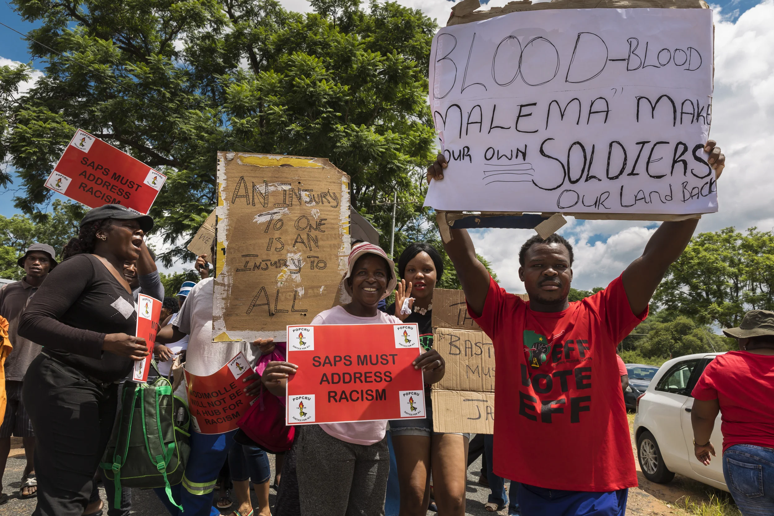 MODIMOLLE, SOUTH AFRICA, 16 FEBRUARY 2017: Black ANC and EFF supporters protest out the court in Modimolle. Stephan Hepburn, a young white farmer is accused of murdering a black farm worker by the name of Jan Railo. Hepburn claims he was out hunting