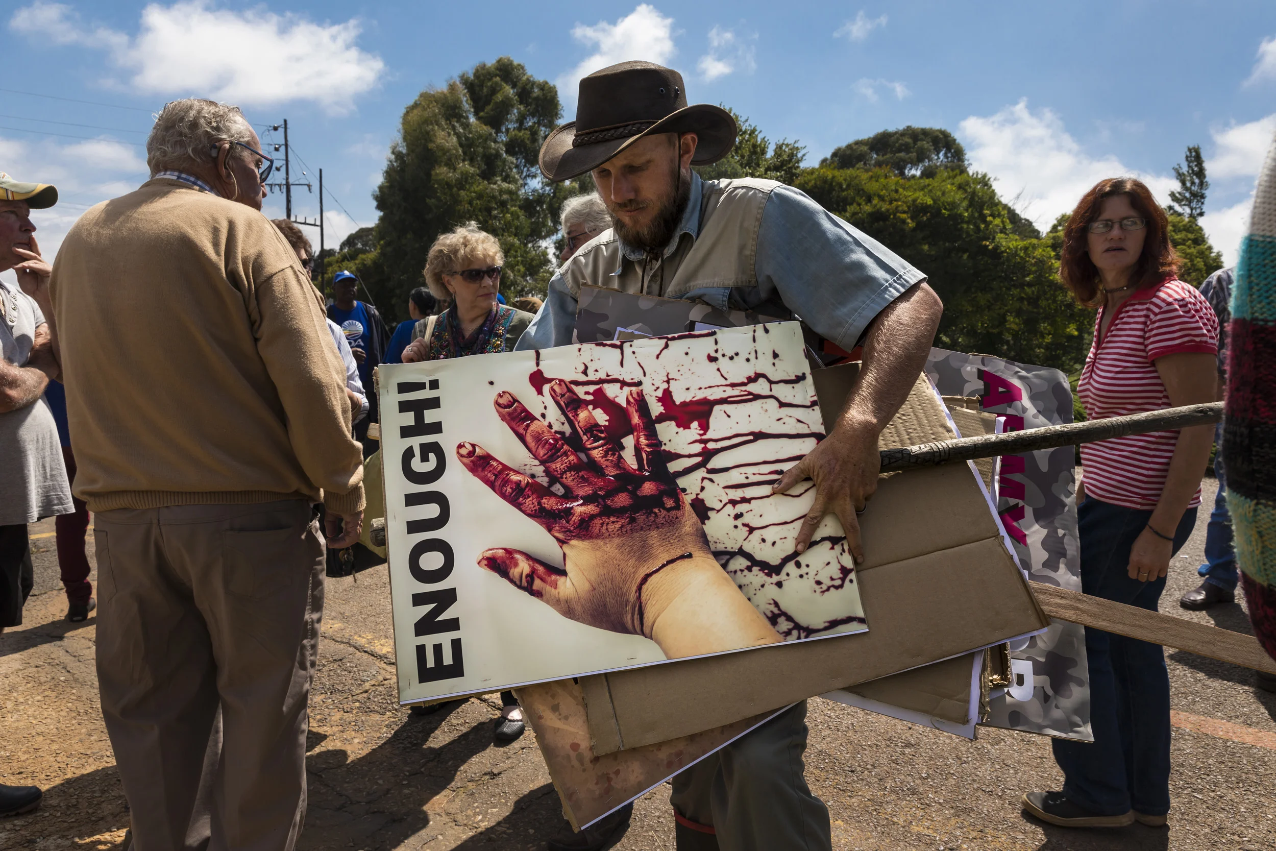 BELFAST, SOUTH AFRICA, 27 FEBRUARY 2017: Farmers and members of the Democratic Alliance protest farm murders outside of the Magistrates Court where this morning three murder suspects will be arraigned for the killing of a local woman and the attempt