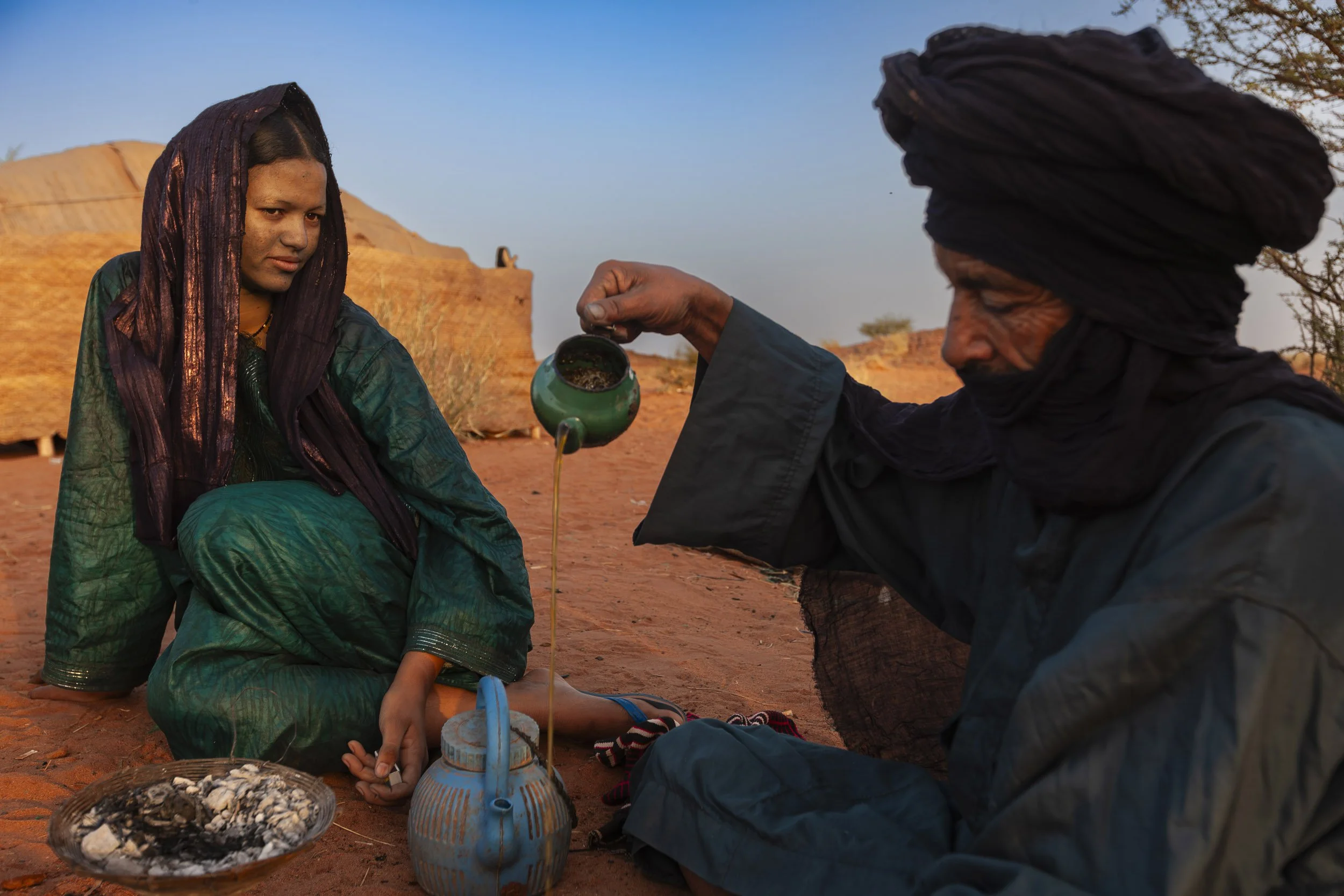 INGAL, NIGER, OCTOBER 2009: Early morning scenes at a Baptism in a Tuareg Nomad camp, Ingal Region, Niger, 11 October 2009. Tuareg Baptism is very simple, three names are discussed by elders and then straws are drawn to choose the final name. The wo