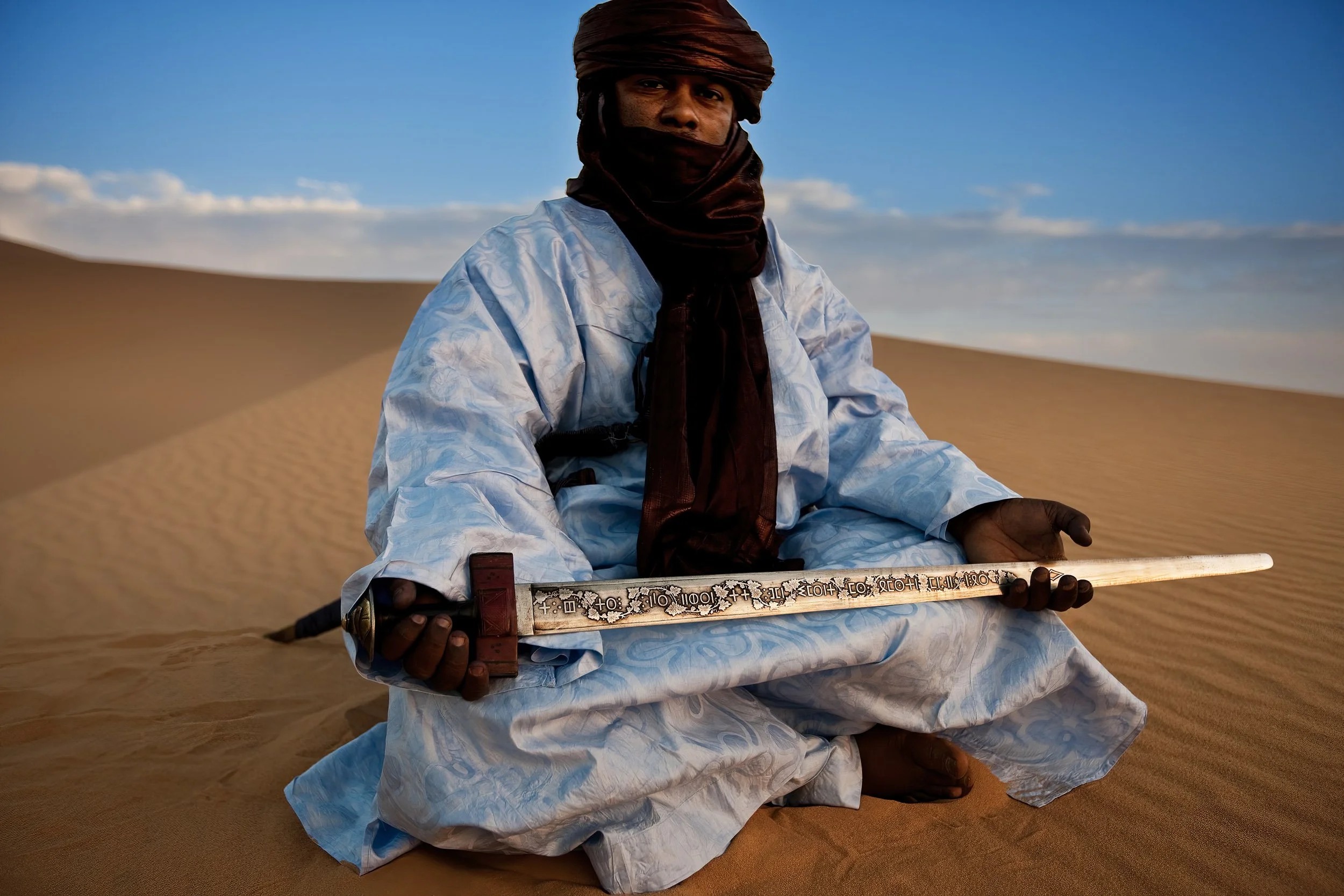 DJANET, ALGERIA, 3 MAY: A Tuareg man poses with the sword handed to the Tuareg leader by the French after the Tuareg were finally defeated at the battle of Tit, photographed in the desert outside the Tuareg town of Djanet, on April 9, 2009. (Photo b