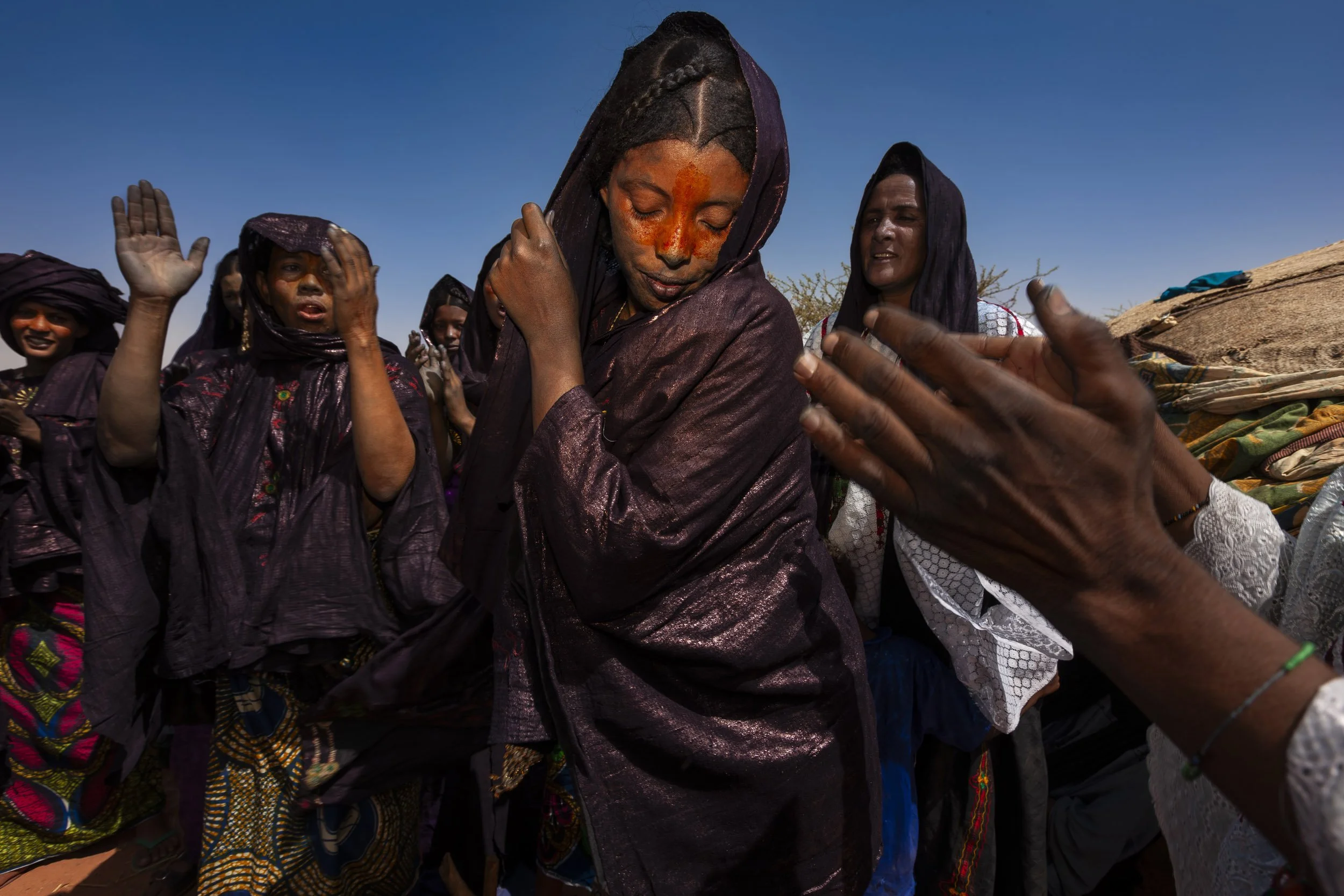 INGAL, NIGER, OCTOBER 2009: Scenes at a Baptism in a Tuareg Nomad camp, Ingal Region, Niger, 11 October 2009. Tuareg Baptism is very simple, three names are discussed by elders and then straws are drawn to choose the final name. The women perform a