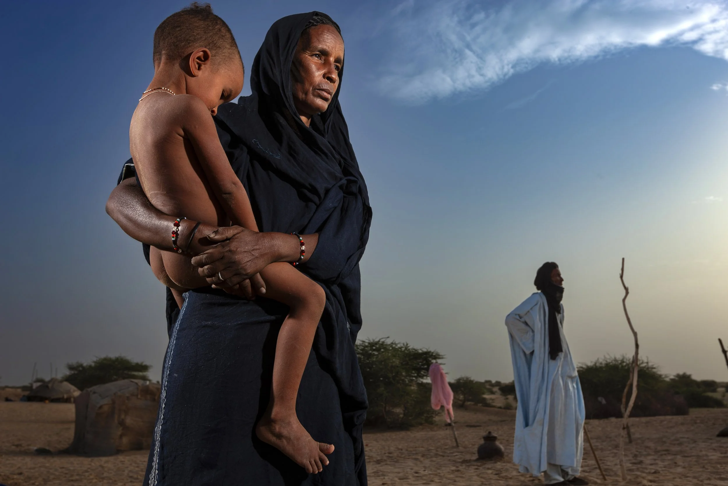 TIMBUKTU, SEPTEMBER 2009: Tuareg nomads and their families camped on the outskirts of Timbuktu during the rainy season, September 6, 2009. The nomads have used this route for centuries, using the same campsites as their forefathers for centuries. T