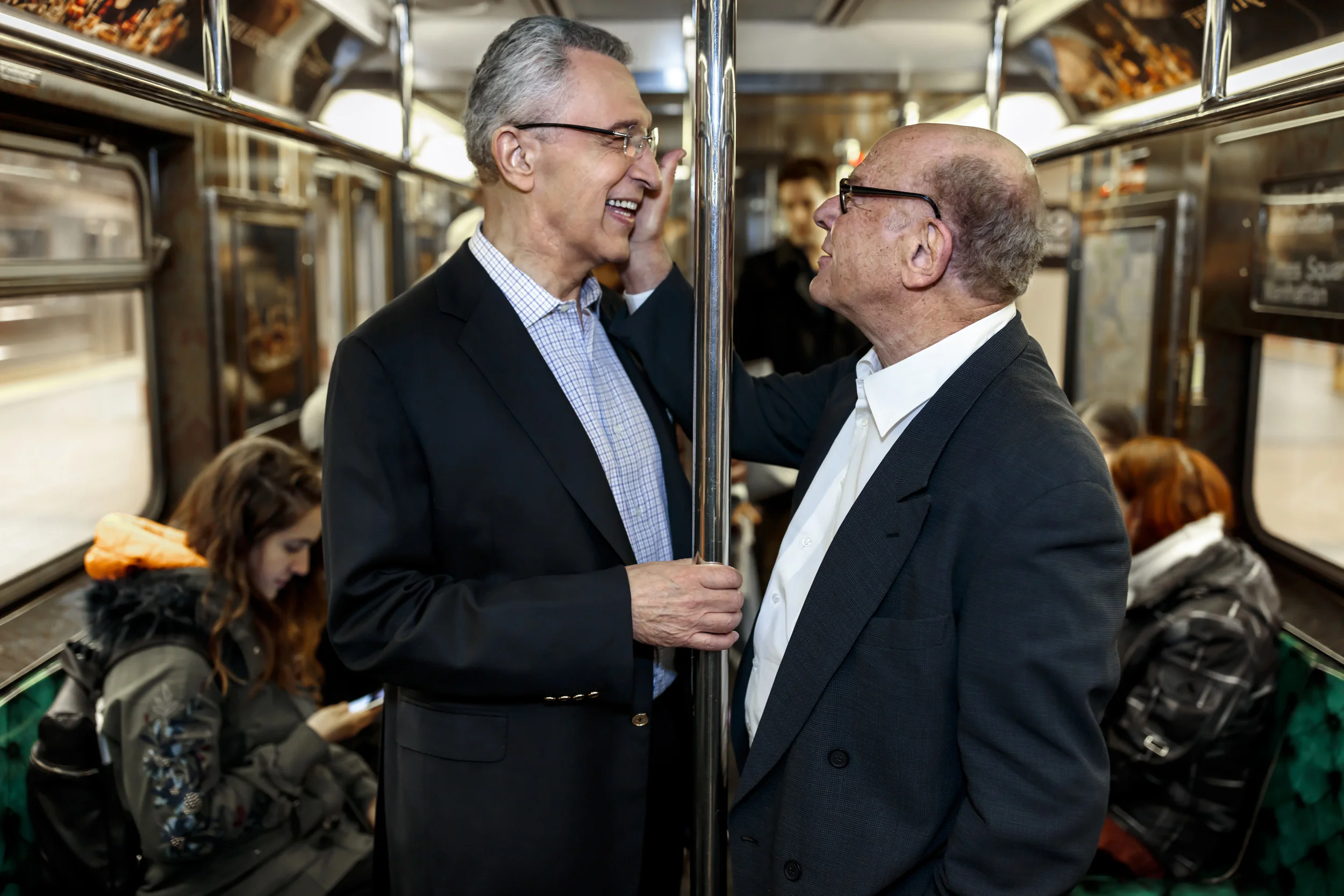 NEW YORK CITY, USA, 18 MARCH 2016: Sandford Greenberg and Art Garfunkel seen riding the New York Subway and also at their Alma Mater Columbia University. Greenberg lost his sight in his first few months at Columbia as a young man. Garfunkel was his