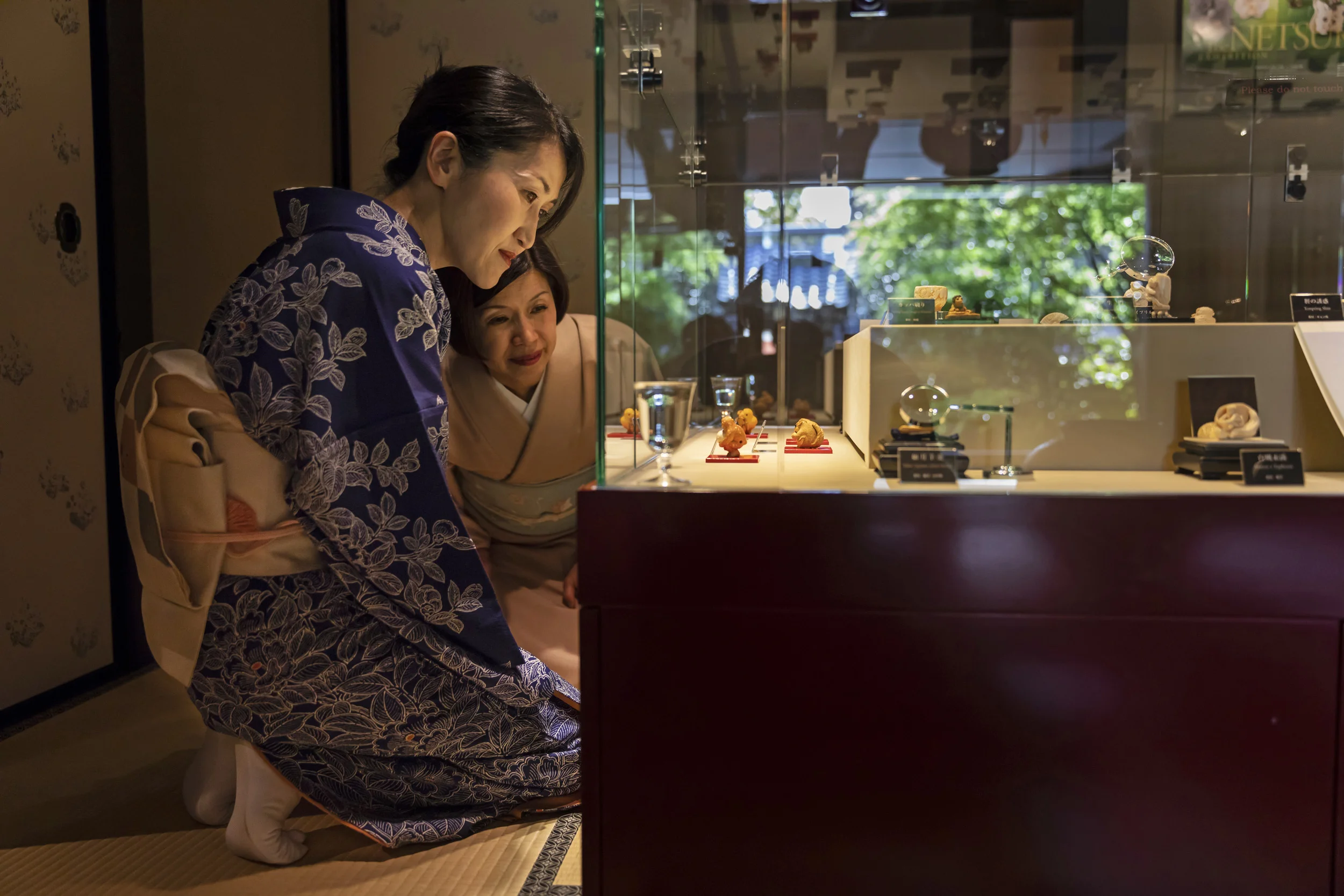 KYOTO, JAPAN, APRIL 2018: Two local Kyoto woman dressed in traditional kimono visit The Netsuke Art Museum, Kyoto. The majority of the high end carvings at the museum are made of ivory, both recent and older carvings. (Photo by Brent Stirton/Verbati