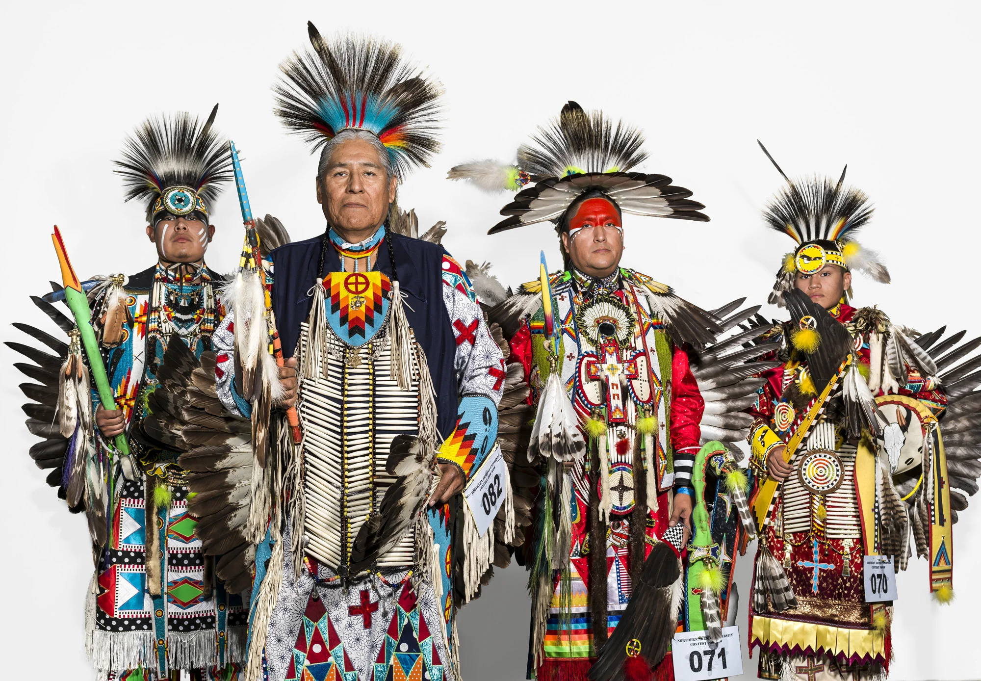 FLAGSTAFF, ARIZONA, 13 APRIL 2014: Four generations of Navajo male dancers are seen at a multi-tribe Pow Wow held in Flagstaff Arizona. The dancers at this Pow Wow come from all over America. Their costumes are not traditional however and these brig
