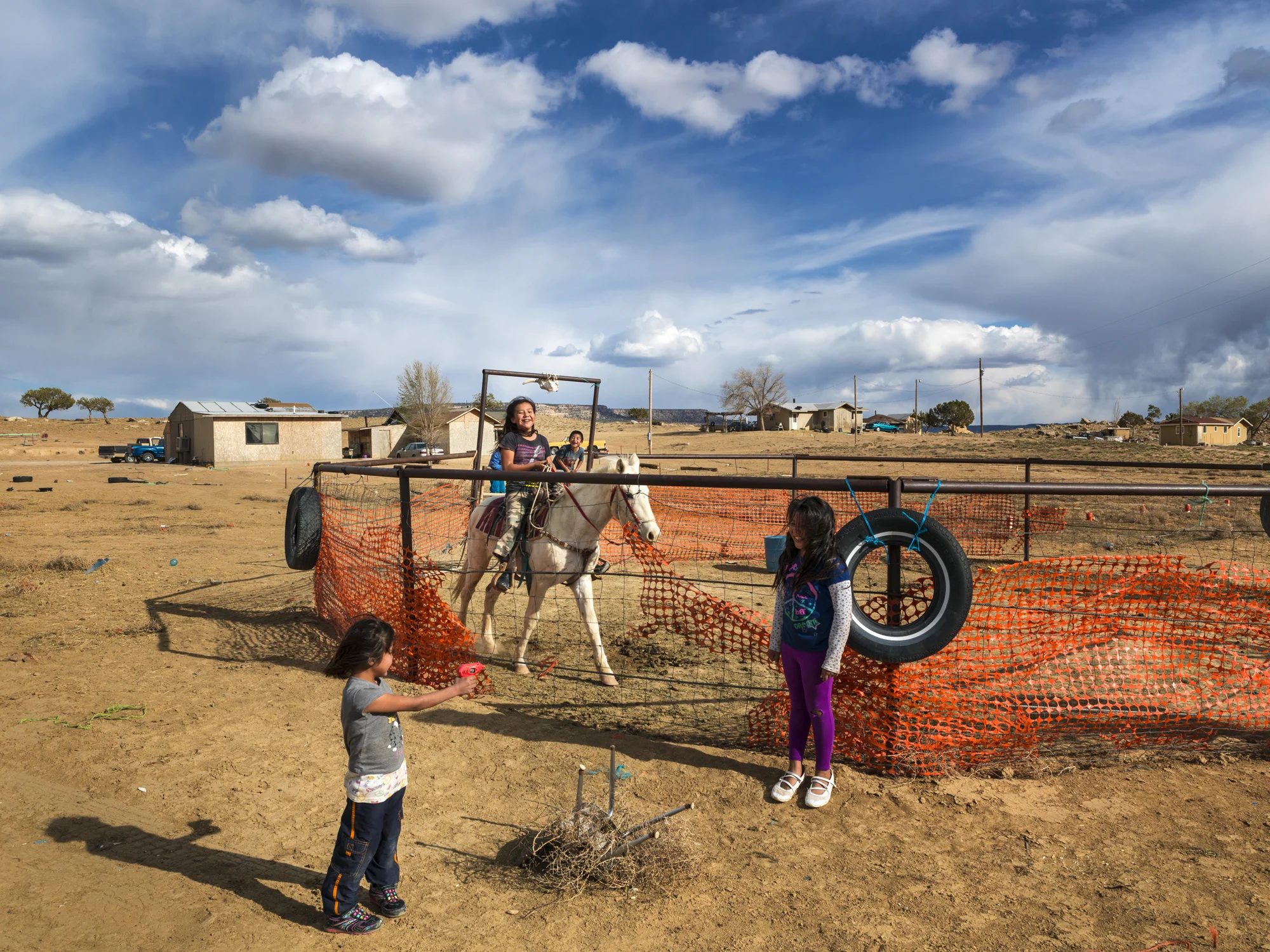 PINON, NAVAJO NATION, ARIZONA, 5 APRIL 2014: Children play on a horse training farm close to the economically depressed area of Pinon, Arizona. (Photo by Brent Stirton/Rpeortage for Le Figaro.)