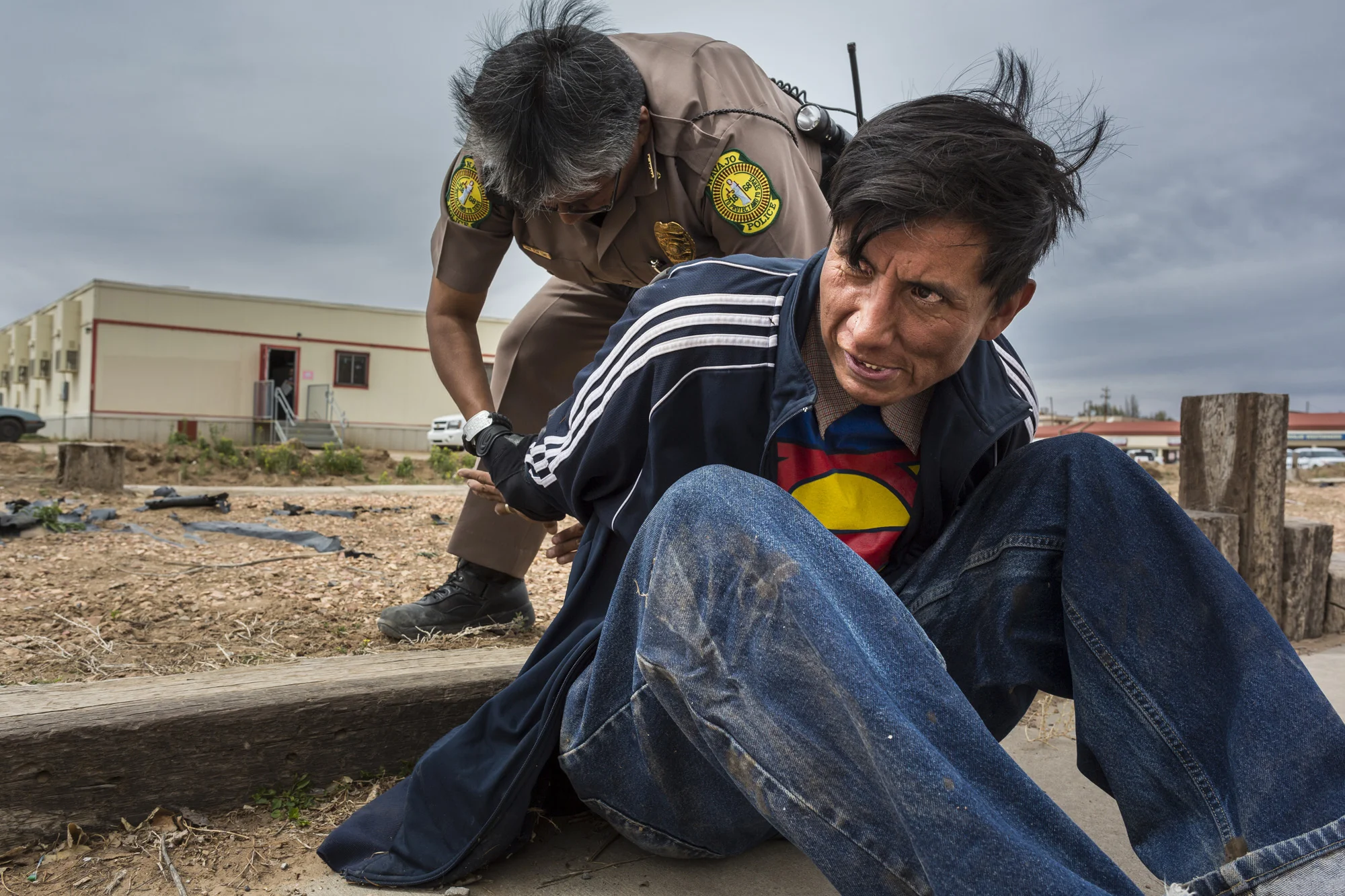 WINDOW ROCK, ARIZONA, 11 APRIL 2014: Senior police officer in the Navajo police Dana Dean Tome arrests a drunk of the streets of WindowRock, Arizona. No alcohol is allowed on the reservation and it is one of the many obstacles faced by the understaf