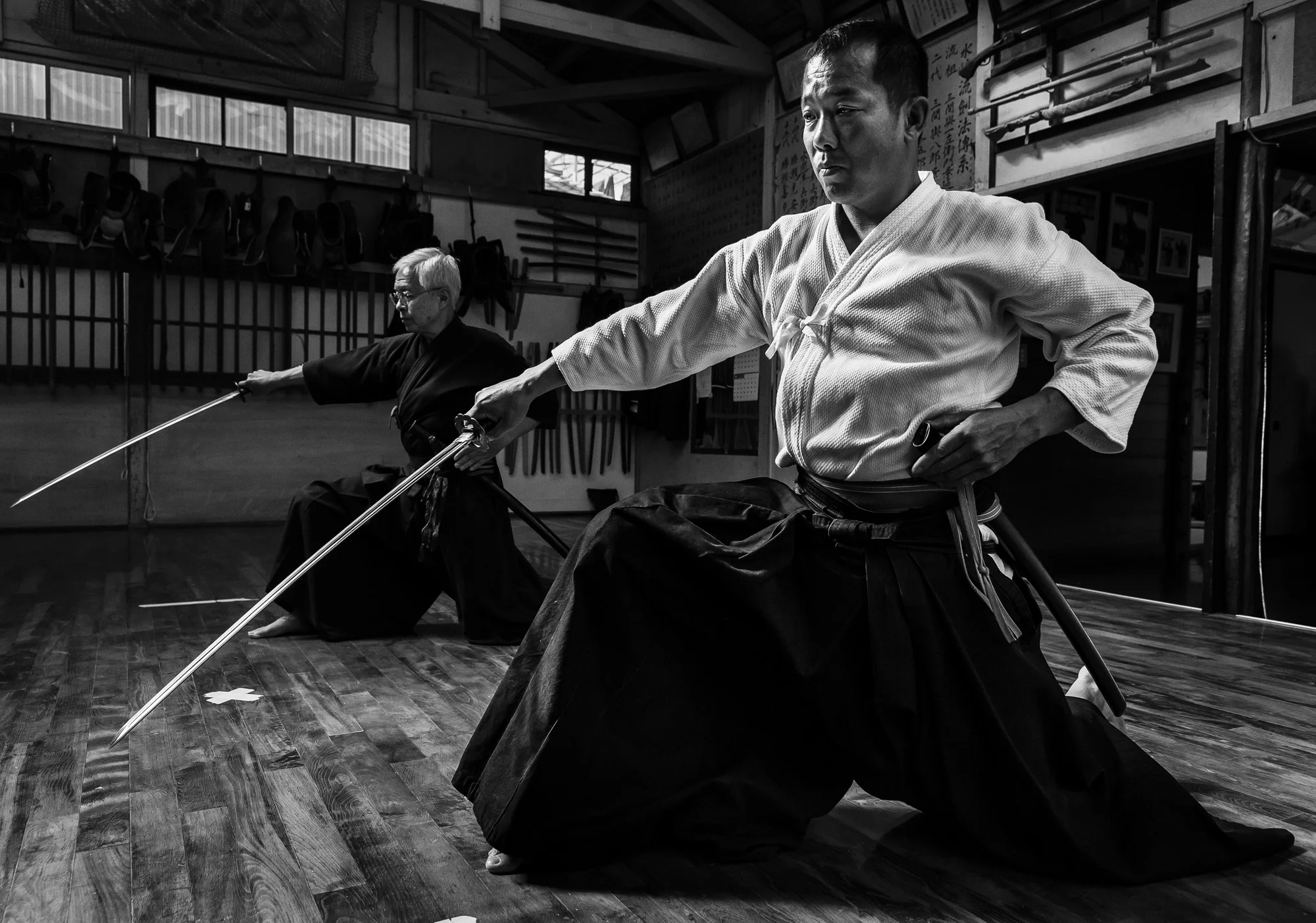 SHIMIZU KU, SHIZUOKA CITY, TOKYO, 16 OCTOBER 2014: Advanced students practise sword skills in the dojo of Master Sensei Yoshimitsu (Kagehiro) Katsuse, a master of all 18 of the Samurai arts. This dojo dates back to the 16th century and is one of ver