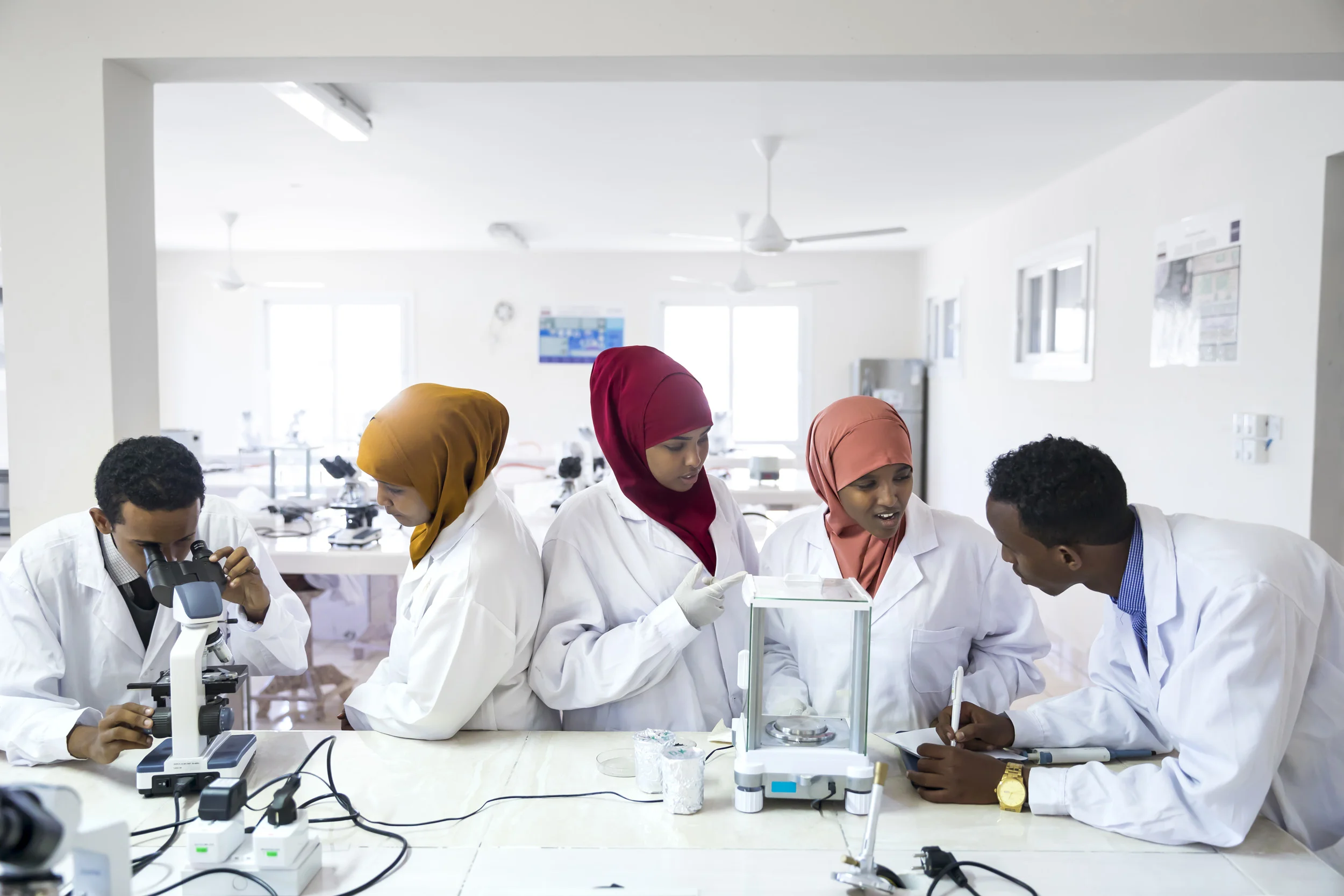 MOGADISHU, SOMALIA, 1 AUGUST 2017: Students at Simad University in Mogadishu learn lab skills in the modern laboratory in Mogadishu. The university has two labs, this one specializes in the study of hematology, micro-biology, bio-chemistry and molec