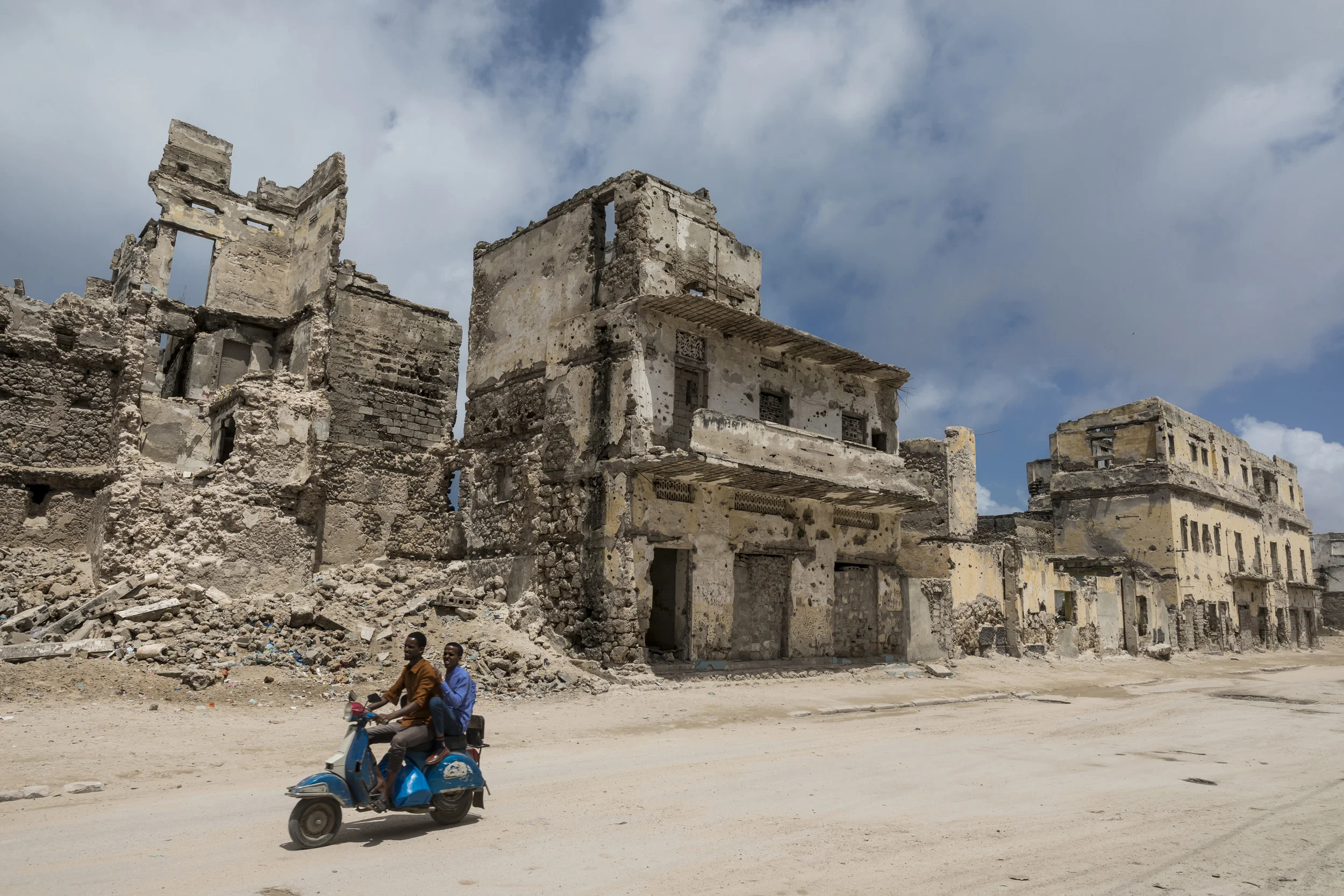 MOGADISHU, SOMALIA, 2 AUGUST 2017: Scenes along the Mogadishu foreshore, destroyed by civil war beginning in the nineteen eighties. These buildings and many others along the foreshore are shrapnel-pitted ruins but they occupy some of the most desire