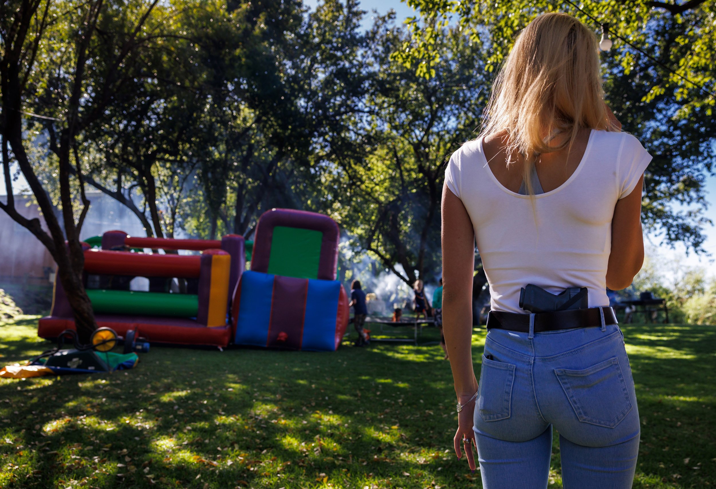 ORANIA, NORTHERN CAPE, SOUTH AFRICA, 15th April 2023: A young woman who is visiting her parents in Orania is seen open carrying her gun at a campsite close to the Orange River in Orania. Hailed as a safe place for whites in crime-ridden South Afric
