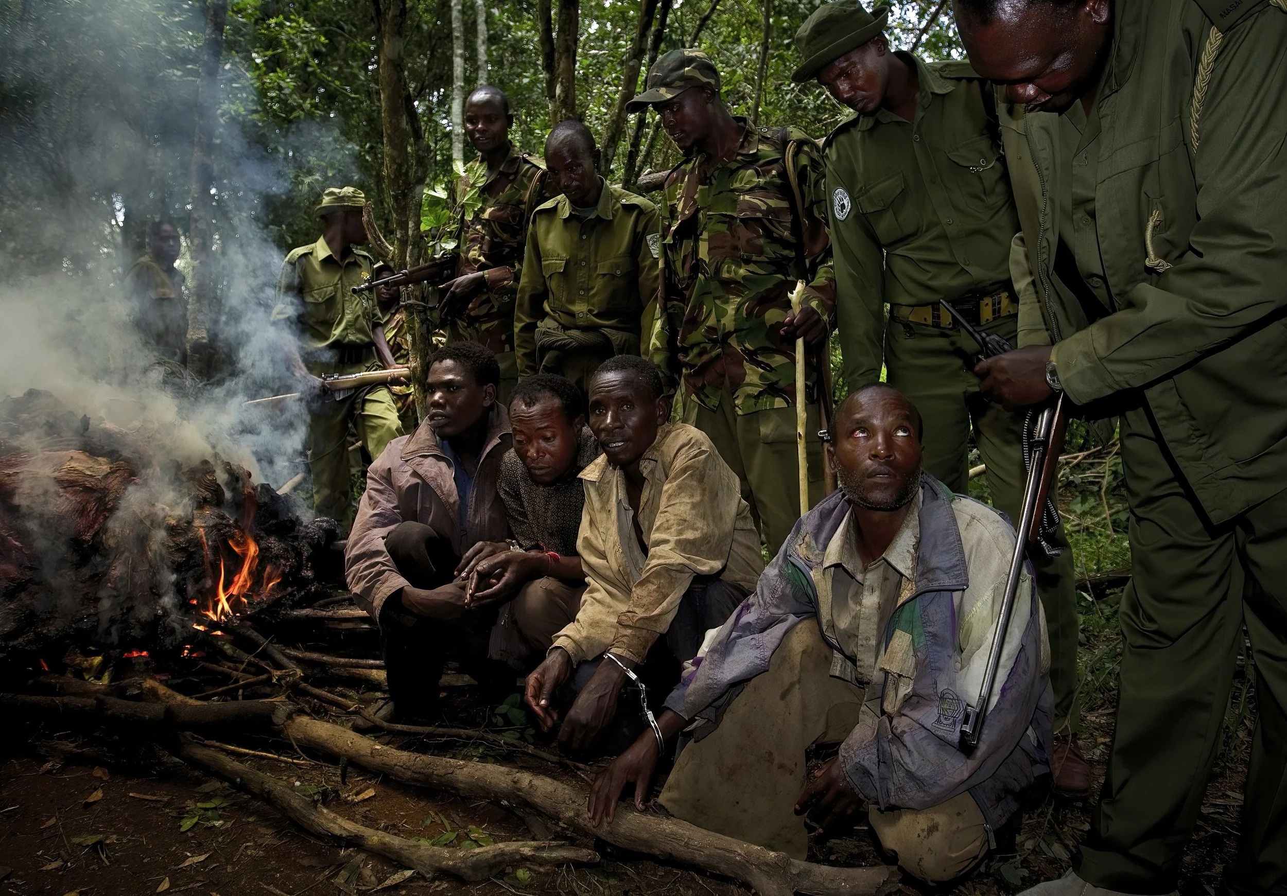 MASAAI MARA NATIONAL RESERVE, KENYA, FEBRUARY 2010. Four Tanzanian poachers are arrested for killing a hippo inside the Masaai Mara National Reserve, Kenya, 21 February 2010. The anti-poaching park rangers are all Masaai men with a strong interest i