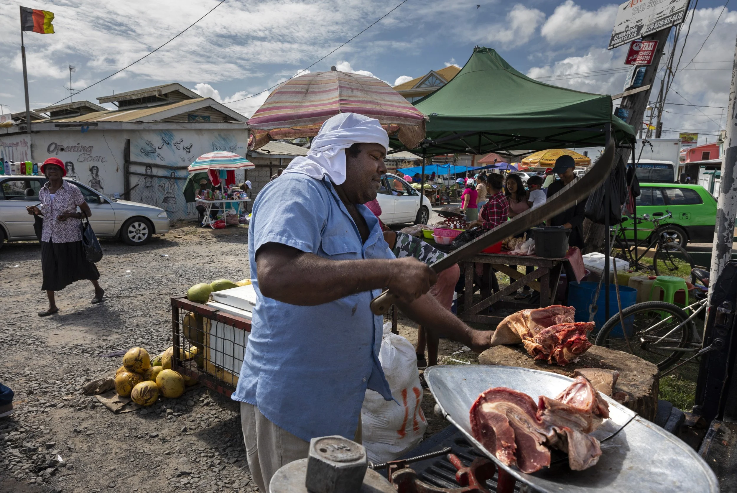 GEORGETOWN, GUYANA, 15TH FEBRUARY 2020: A wildmeat hunter and trader, name withheld, is seen selling wildmeat at a roadside market in Georgetown. He says he has been doing this job for over 20 years, starting when he shot animals who were raiding cr