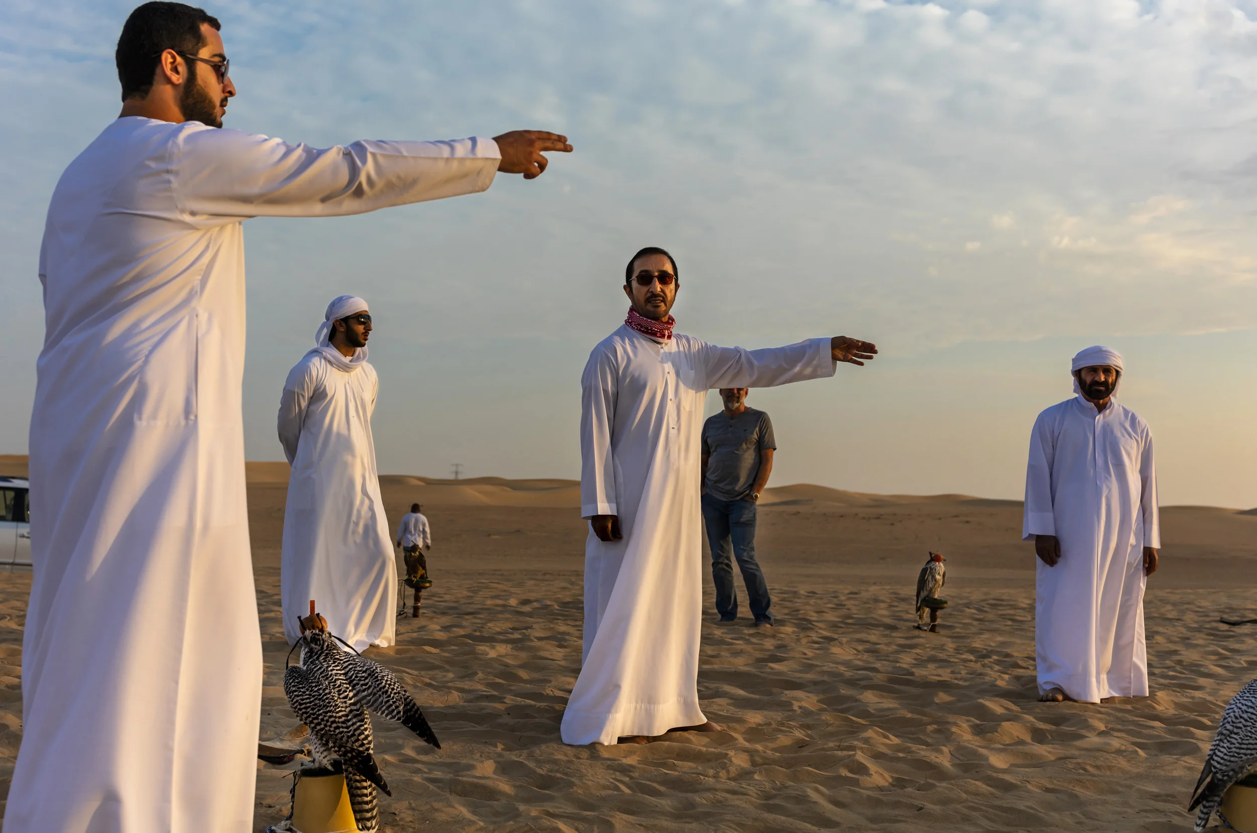 DUBAI, UAE, OCTOBER 18, 2018: Sheikh Butti Maktoum Bin Juma, a senior member of the Dubai Royal family, is seens with his sons and assistants while he trains his falcons in the desert outside Dubai. The Sheikh begins before dawn during the season, u