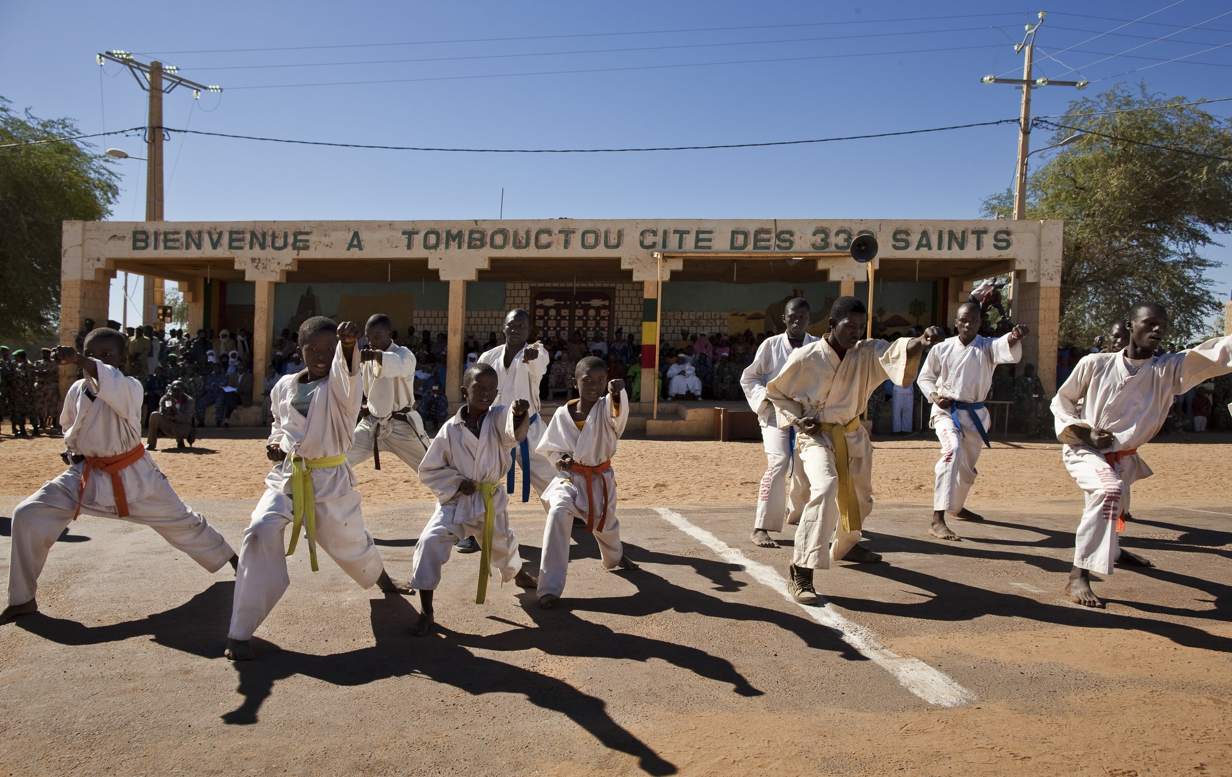 TIMBUKTU, MALI, JANUARY 2010: Armed Forces Day in Timbuktu, the mythical Northern Mali city, with martial arts displays and an appearance for a march past from different groups of the Mali Defence force and its veterans as well as an address by the