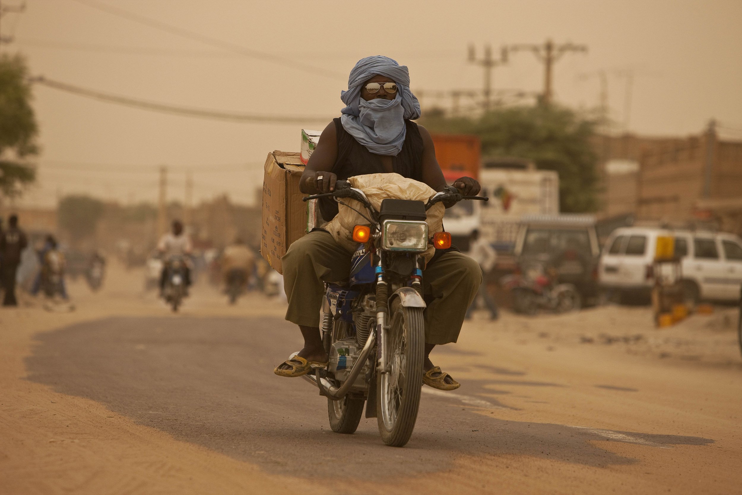 TIMBUKTU, SEPTEMBER 2009: The desert is ever-encroaching on the roads of Timbuktu, some days the white lines are there, other days they're not, Timbuktu, 18 September 2009. (Photo by Brent Stirton/National Geographic.)