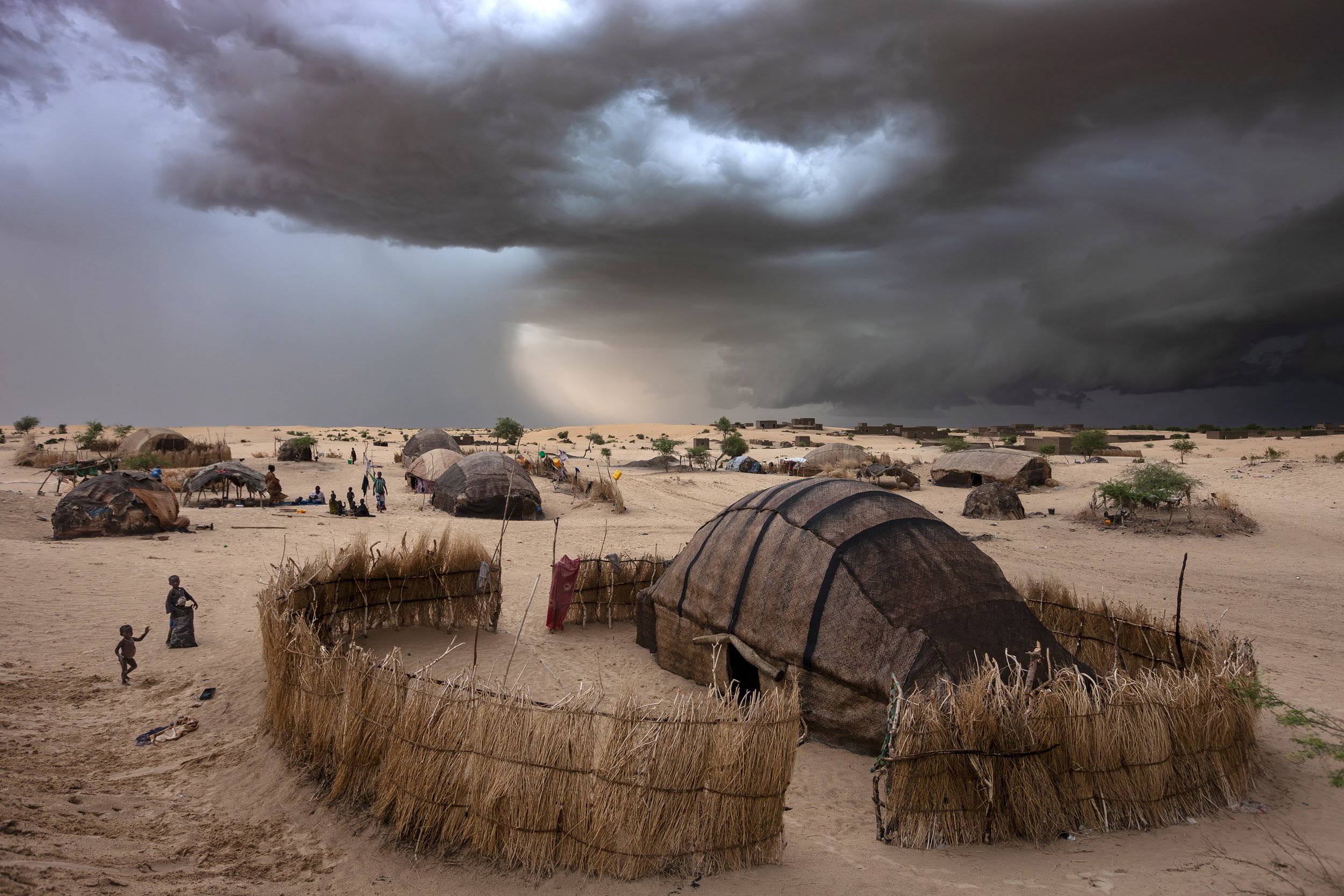 TIMBUKTU, SEPTEMBER 2009: Images of camps and houses on the outskirts of Timbuktu just before a fast approaching rainstorm, Mali, September 11, 2009. Timbuktu is a historical Malian city, a long established centre of learning for Africa. It has trad
