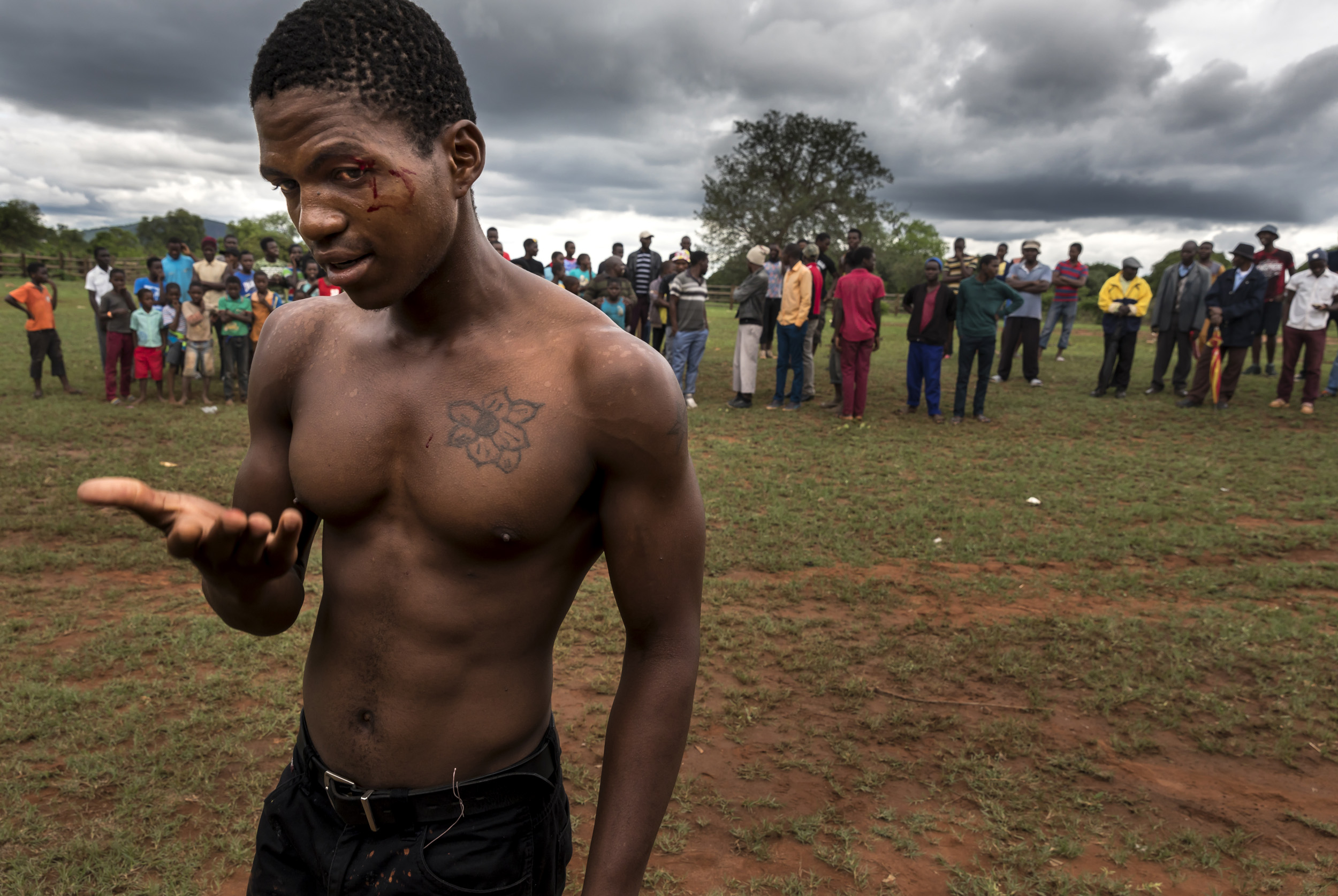 TSHIFIDI, VENDA, SOUTH AFRICA, 15 DECEMBER 2016: Men and boys of the Venda tribe challenge each other and fight bare knuckle over the festive period in South Africa. This is a tradition that dates back 200 years and began when herd boys tried to get