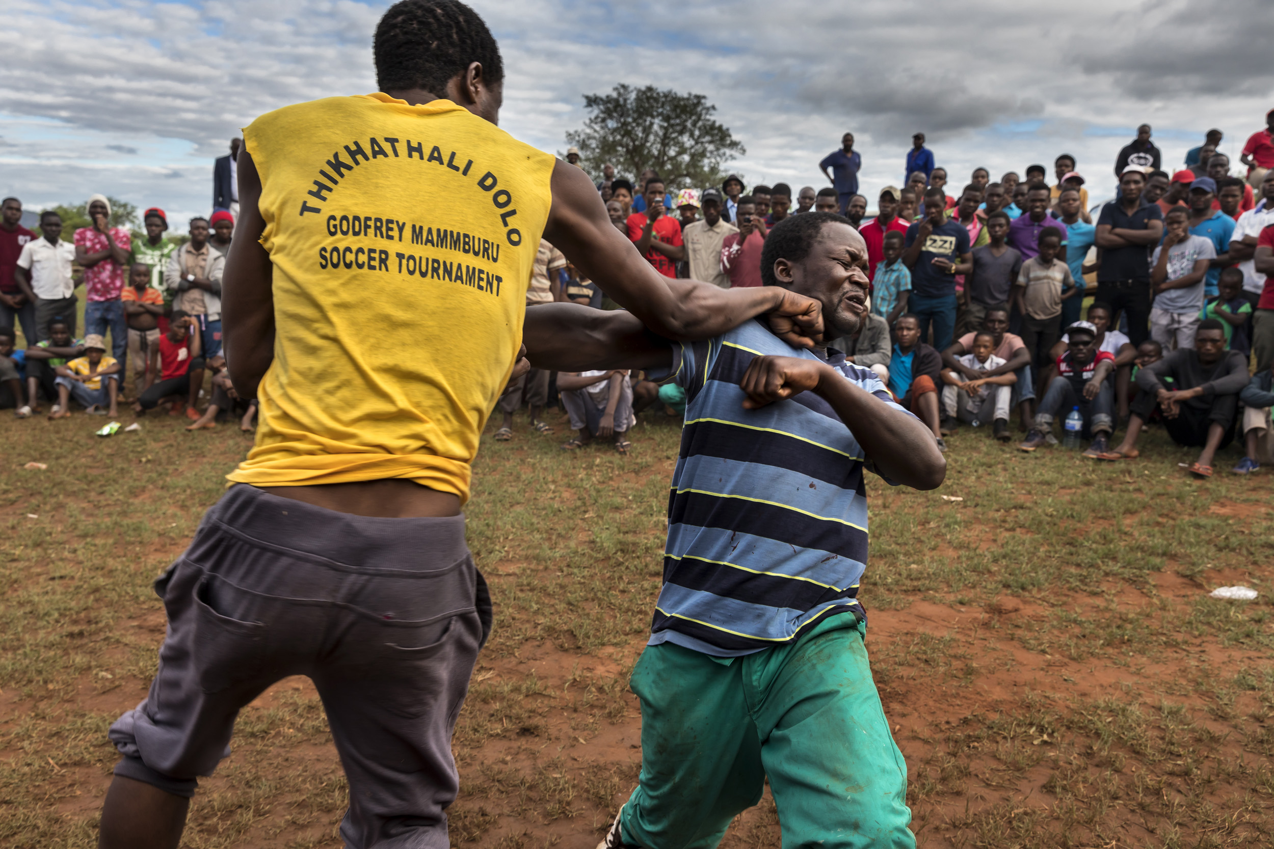 TSHIFIDI, VENDA, SOUTH AFRICA, 15 DECEMBER 2016: Men and boys of the Venda tribe challenge each other and fight bare knuckle over the festive period in South Africa. This is a tradition that dates back 200 years and began when herd boys tried to get