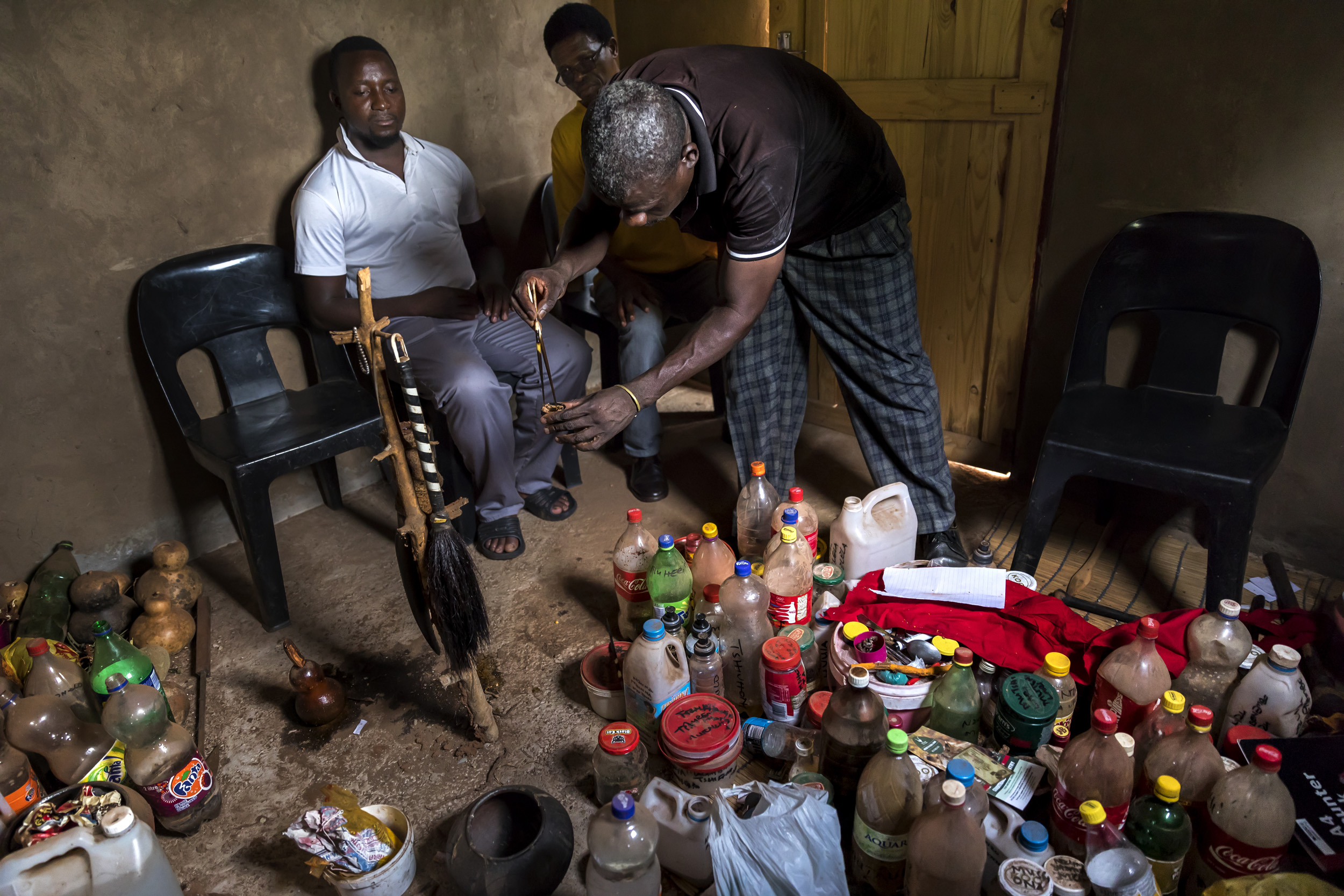 VENDA, SOUTH AFRICA, 11 DECEMBER 2016: "Zero" real name Enoch Kwinda, 31, consults a traditional healer/Sangoma who prescribes him a concoction called Thari. This is supposed to boost Zero's fighting prowess and make him invisible to his fighting op