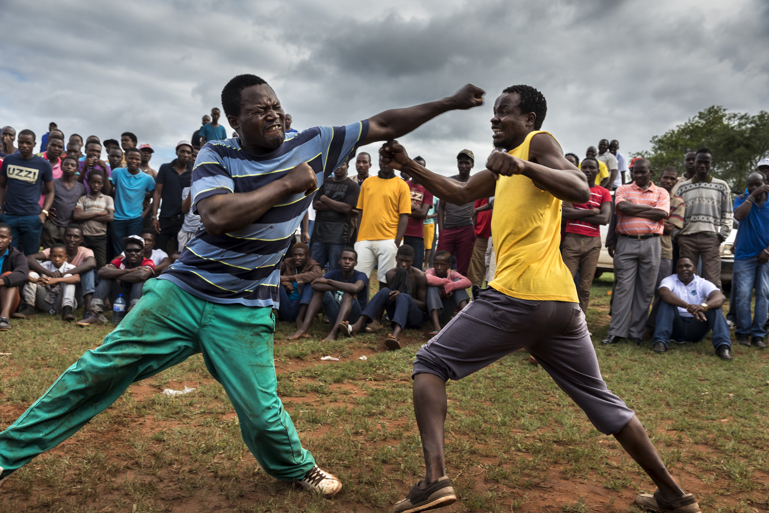 TSHIFIDI, VENDA, SOUTH AFRICA, 15 DECEMBER 2016: Men and boys of the Venda tribe challenge each other and fight bare knuckle over the festive period in South Africa. This is a tradition that dates back 200 years and began when herd boys tried to get