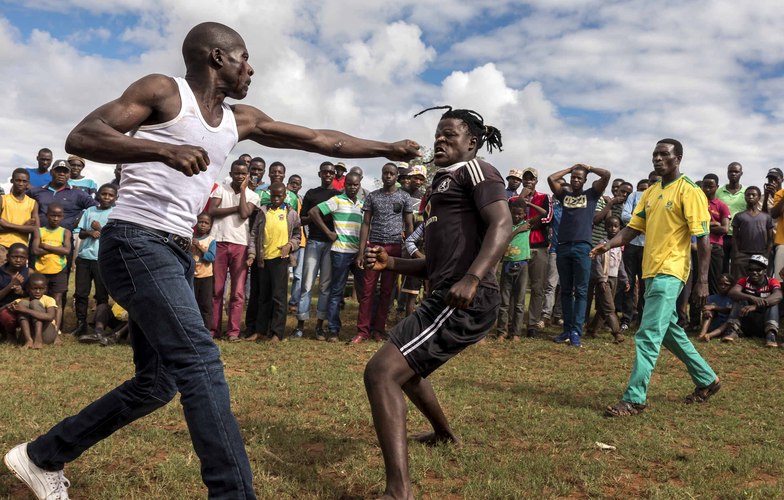 TSHIFIDI, VENDA, SOUTH AFRICA, 15 DECEMBER 2016: Men and boys of the Venda tribe challenge each other and fight bare knuckle over the festive period in South Africa. This is a tradition that dates back 200 years and began when herd boys tried to get
