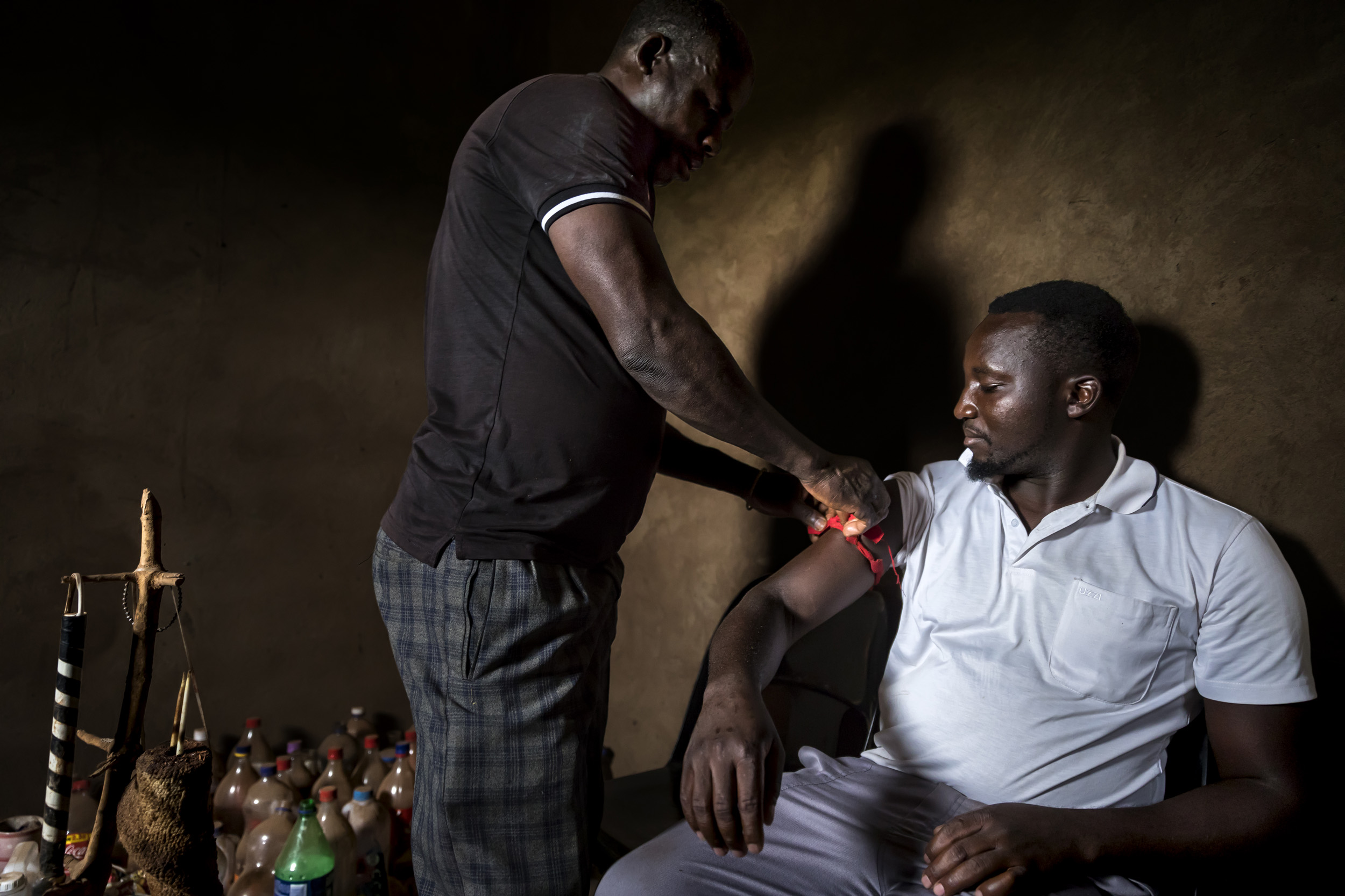 VENDA, SOUTH AFRICA, 11 DECEMBER 2016: "Zero" real name Enoch Kwinda, 31, consults a traditional healer/Sangoma who prescribes him a concoction called Thari. This is supposed to boost Zero's fighting prowess and make him invisible to his fighting op
