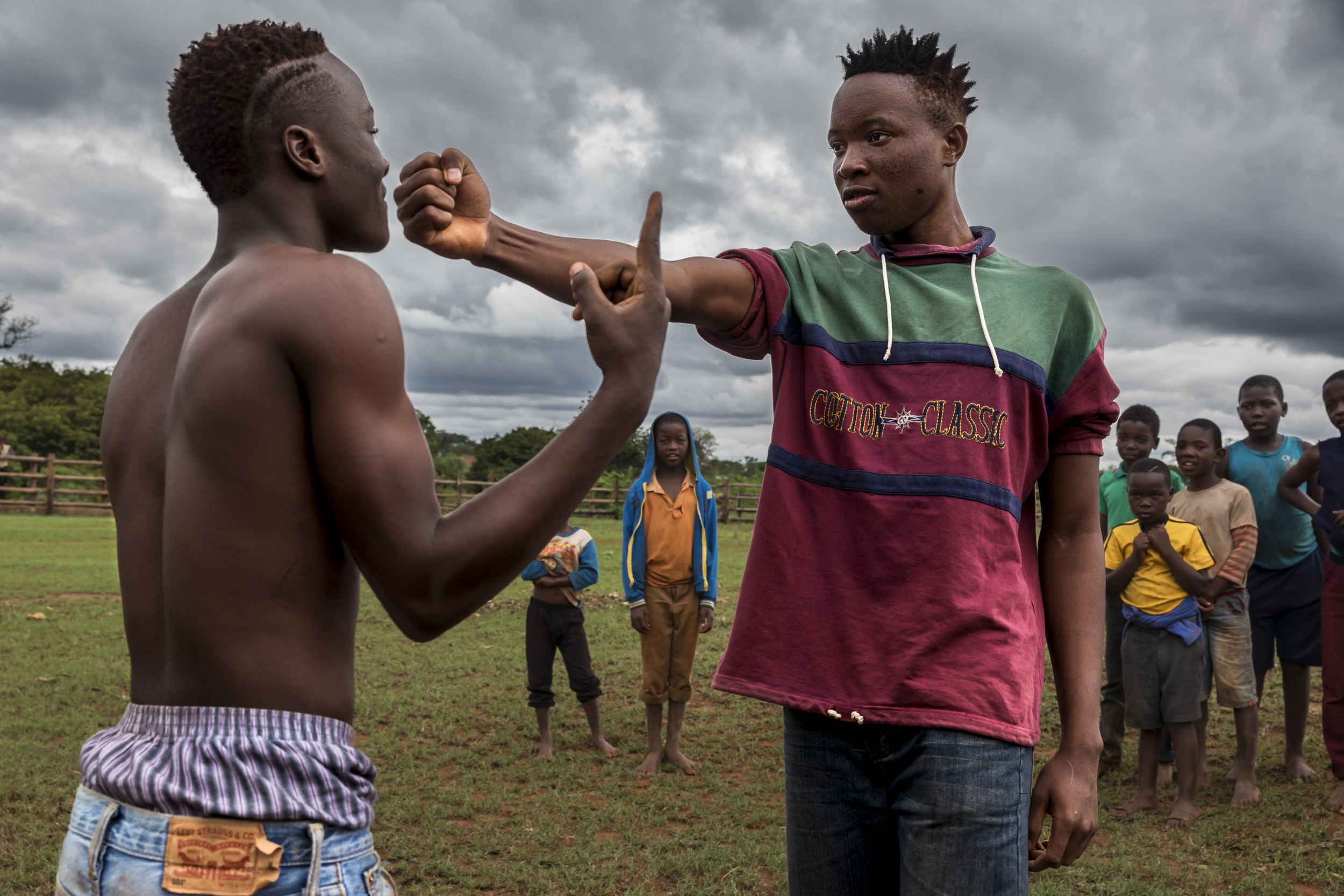 TSHIFIDI, VENDA, SOUTH AFRICA, 15 DECEMBER 2016: Men and boys of the Venda tribe challenge each other and fight bare knuckle over the festive period in South Africa. This is a tradition that dates back 200 years and began when herd boys tried to get