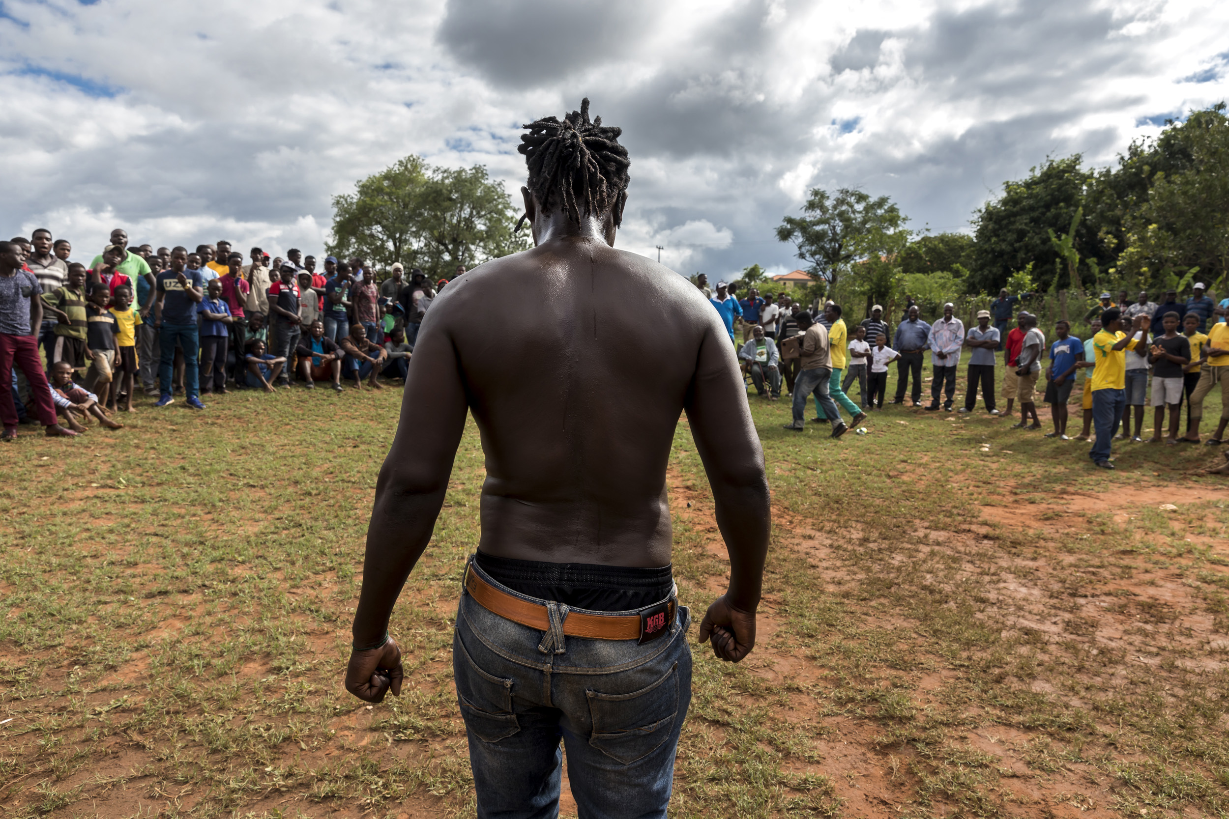 TSHIFIDI, VENDA, SOUTH AFRICA, 15 DECEMBER 2016: Men and boys of the Venda tribe challenge each other and fight bare knuckle over the festive period in South Africa. This is a tradition that dates back 200 years and began when herd boys tried to get
