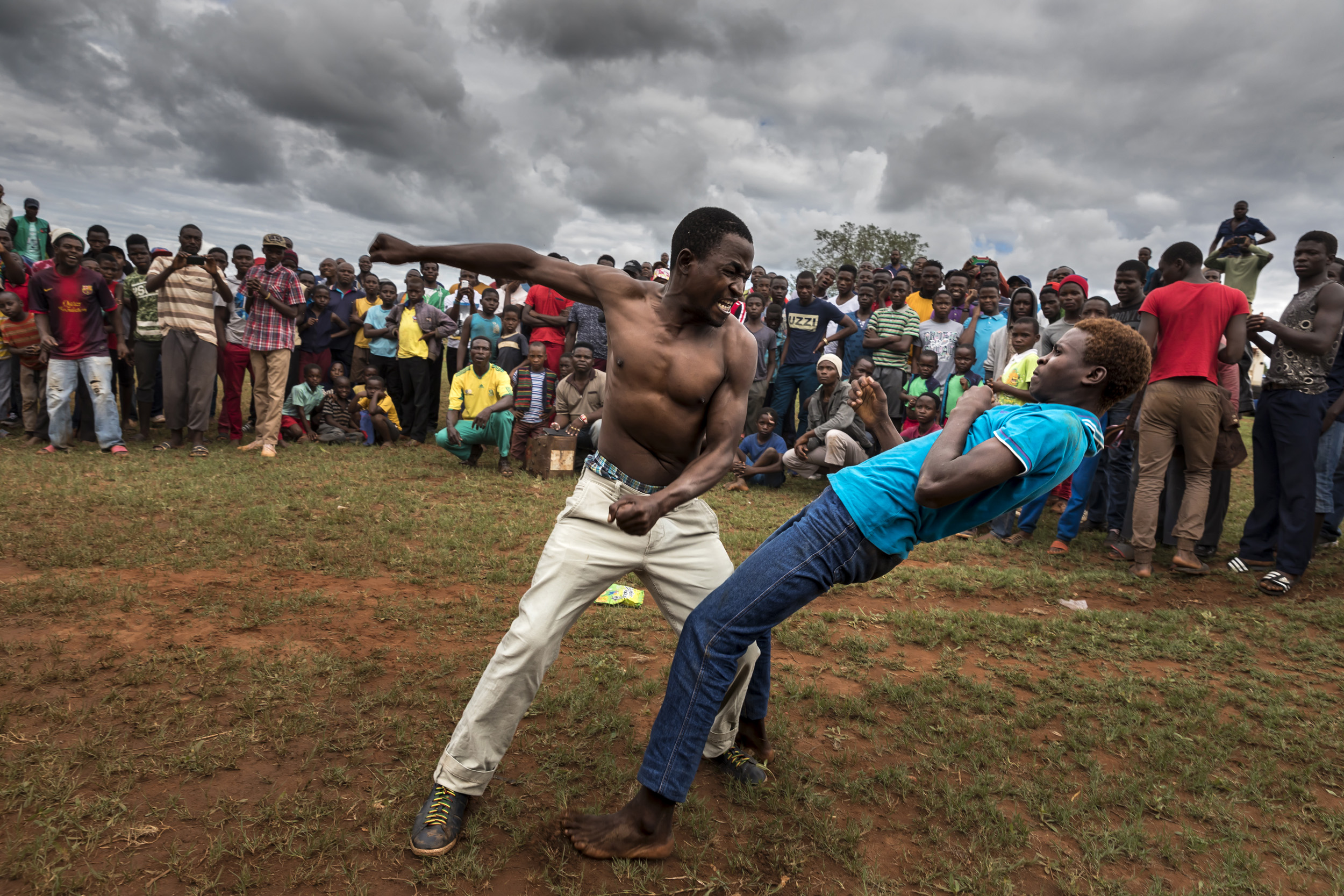 TSHIFIDI, VENDA, SOUTH AFRICA, 15 DECEMBER 2016: Men and boys of the Venda tribe challenge each other and fight bare knuckle over the festive period in South Africa. This is a tradition that dates back 200 years and began when herd boys tried to get