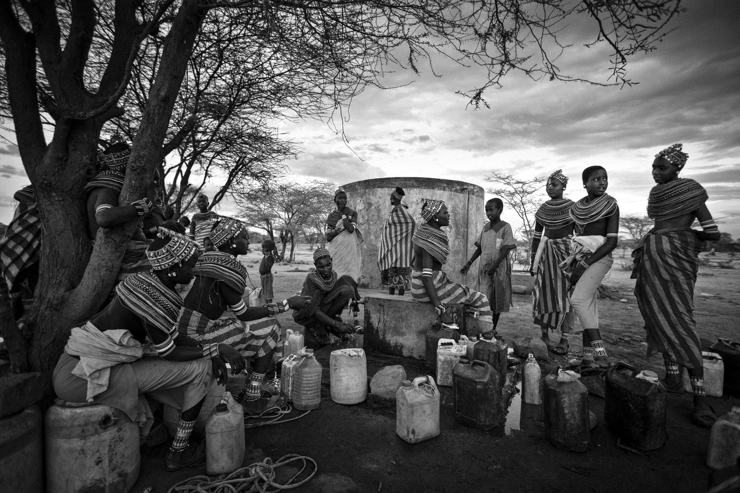 LAISAMIS, MARSABIT SOUTH, NORTH KENYA: Rendille women collect water from a well at the new Manyata Koya, a relocated village which moved 42 kilometers from the original Koya in 1992 due to heavy cattle raiding and fighting with the Borana tribe, Nor