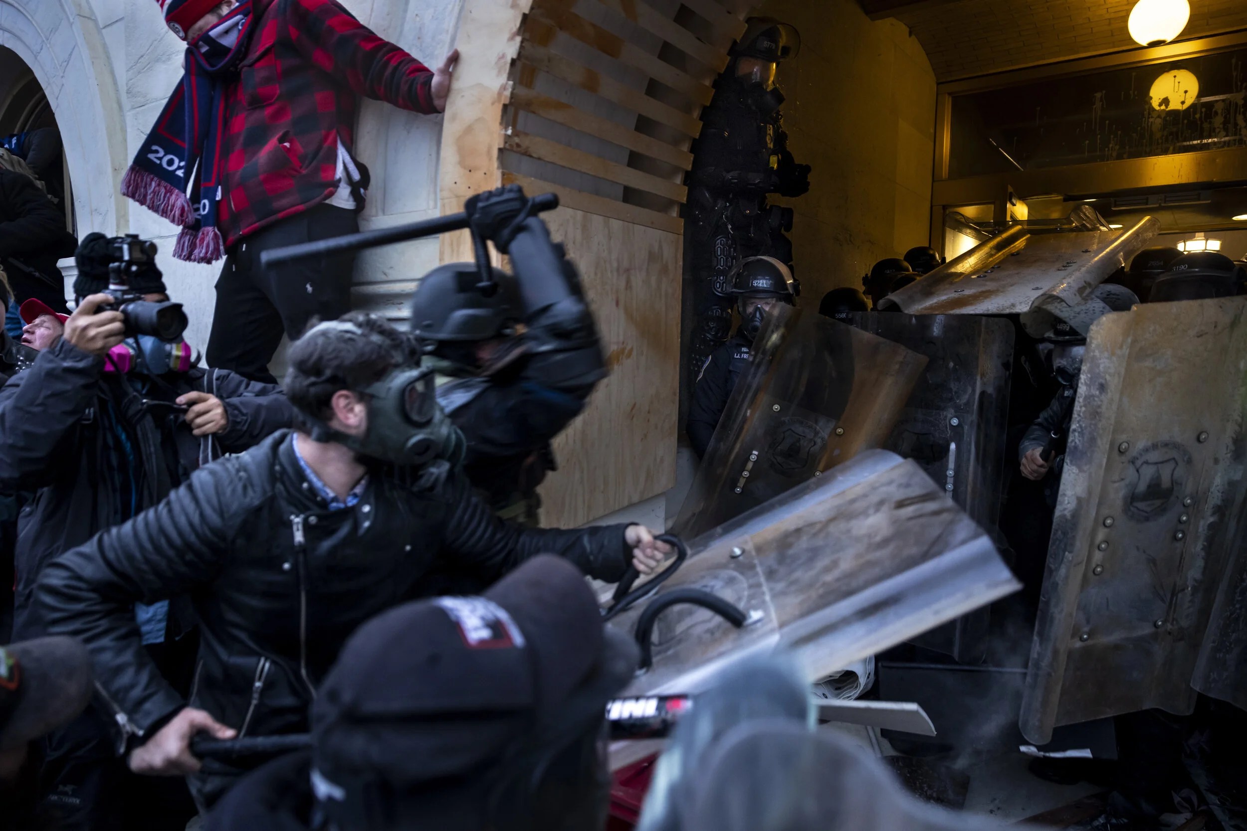 WASHINGTON D.C., USA - JANUARY 6: Trump supporters clash with police and security forces as people try to storm the US Capitol in Washington D.C on January 6, 2021. - Demonstrators breeched security and entered the Capitol as Congress debated the 20