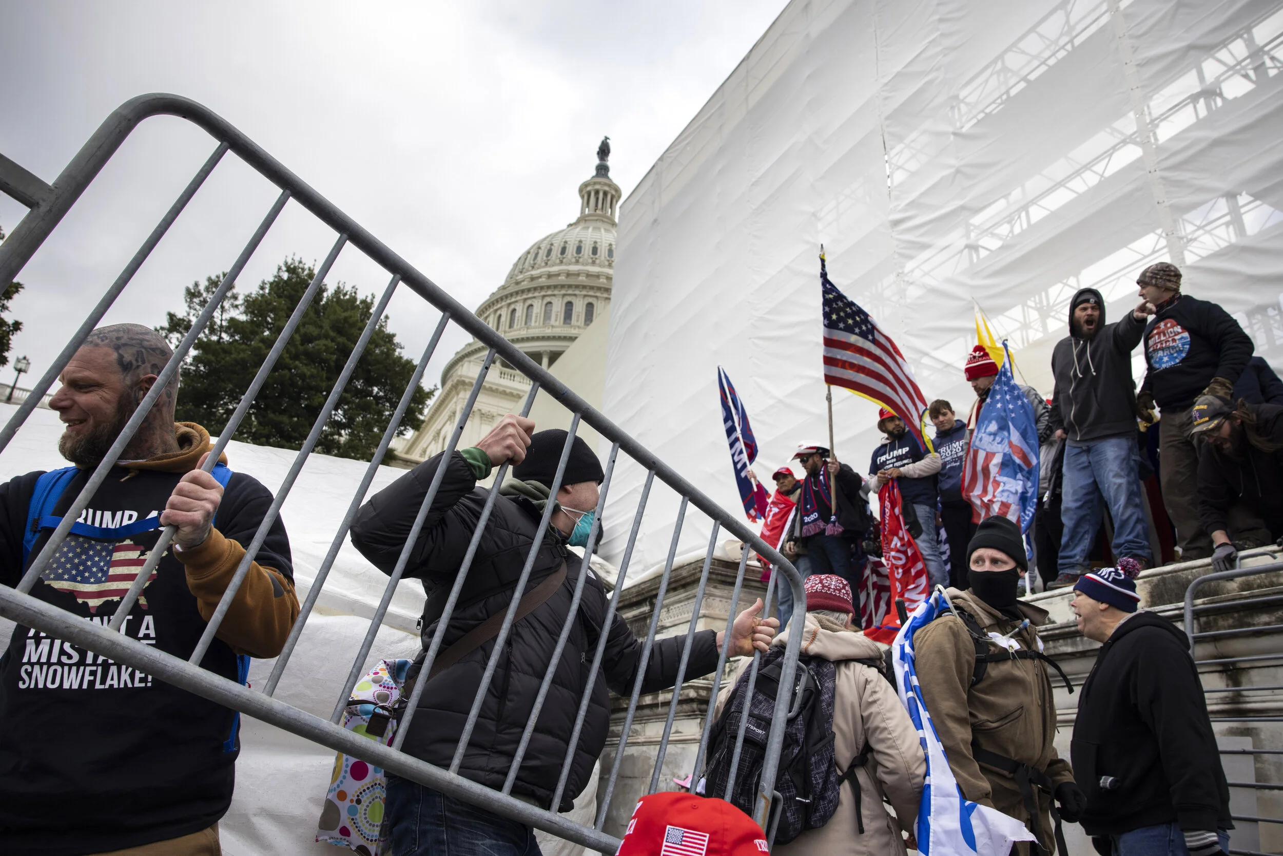 WASHINGTON D.C., USA - JANUARY 6: Trump supporters clash with police and security forces as people try to storm the US Capitol in Washington D.C on January 6, 2021. Demonstrators breeched security and entered the Capitol as Congress debated the 2020