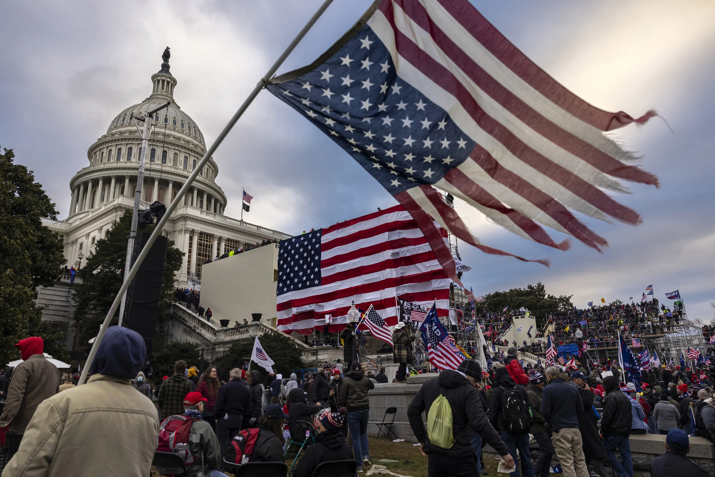 nation's capital to protest the ratification of President-elect Joe Biden's Electoral College victory over President Trump in the 2020 election. A pro-Trump mob later stormed the Capitol, breaking windows and clashing with police officers. Five peop