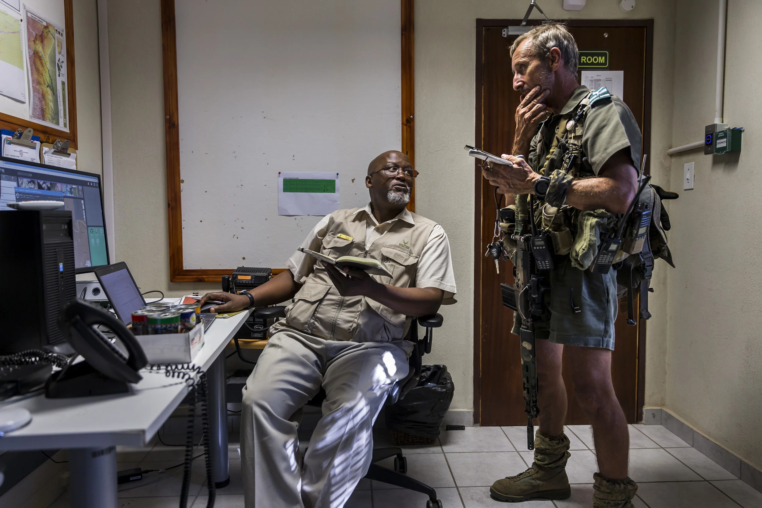 KRUGER NATIONAL PARK, SOUTH AFRICA, 25 APRIL 2016: Member of Kruger National Park's anti-poaching K9 unit enter a helicopter on their way to track 3 rhino poachers. The mission was successful and the suspects were apprehended before they could shoot