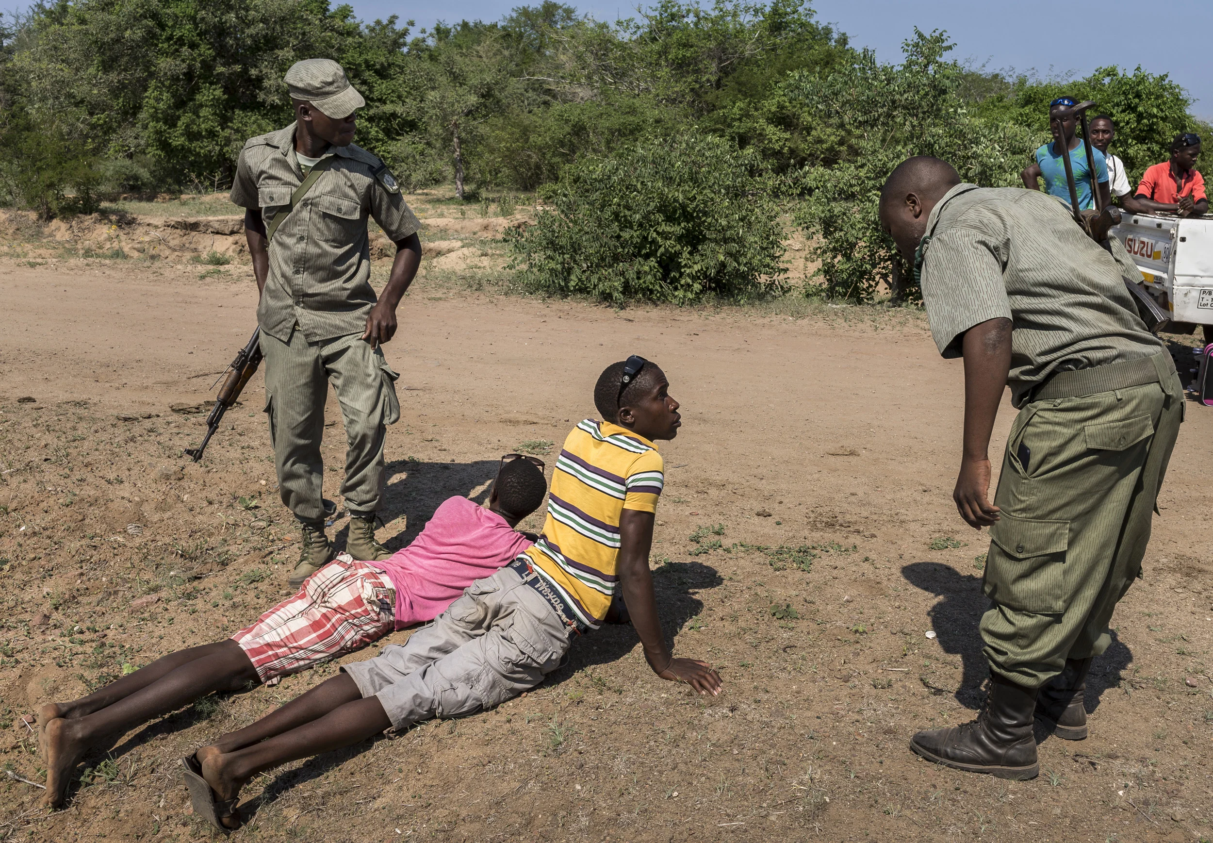BAPTINE, MOZAMBIQUE, 1 APRIL 2016: A member of Sabie Game Park's IAPF contingent works with Mozabican Fauna Bravia units searching new and suspicious looking cars for evidence of Rhino poaching. Fauna Bravia are wildlife police in Mozambique. This i