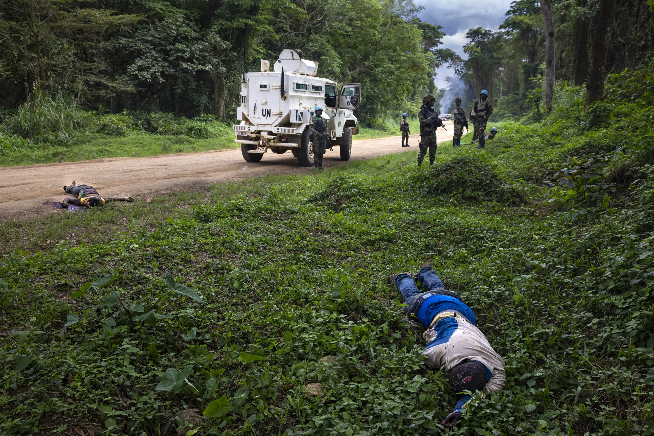 KILYA, RWENZORI SECTOR, DEMOCRATIC REPUBLIC OF CONGO, 9 APRIL 2021: Congolese Army soldiers and UN forces inspect an ambush site where an hour previously A.D.F fundamentalist rebels attacked two vehicles on the road between Beni and the Ugandan bord