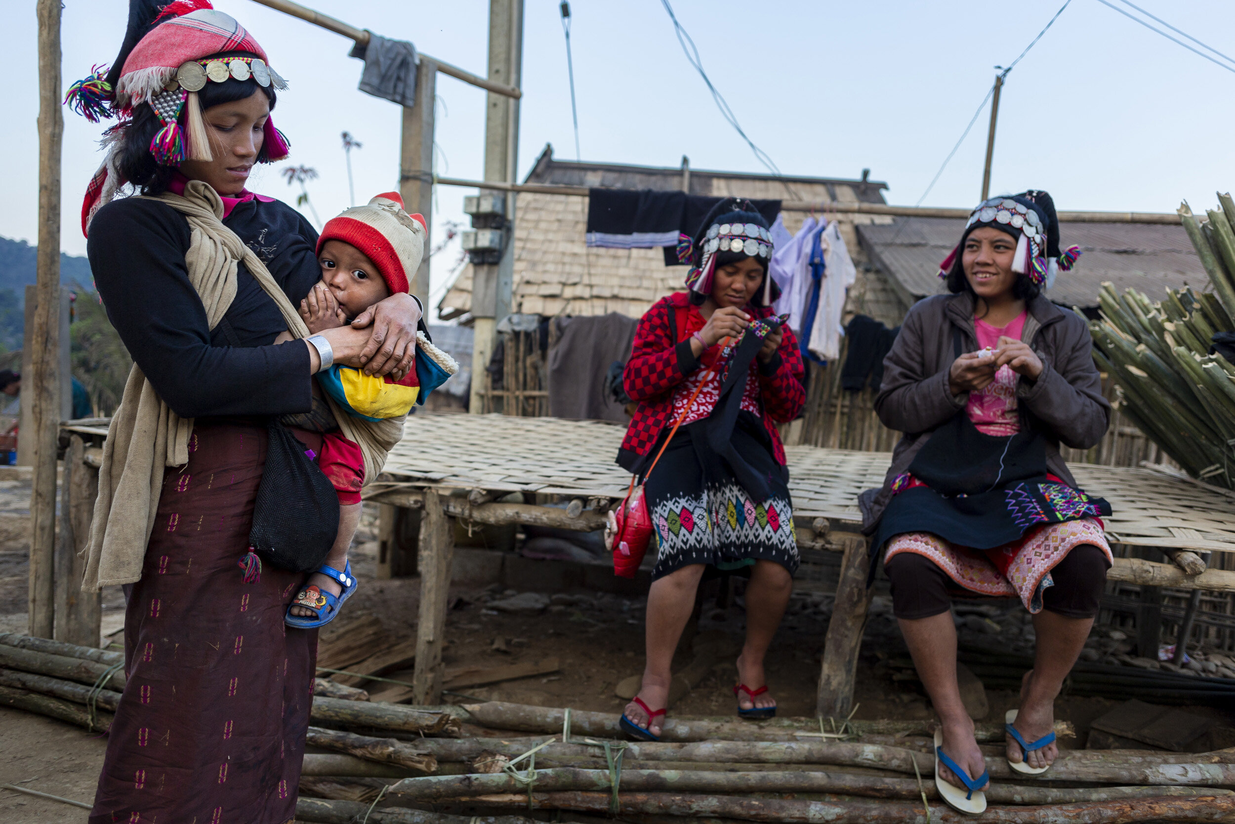 HIGHLANDS, LAOS, FEB 9TH, 2014: An Akha tribal woman breastfeeds her baby son. The highest percentage use of pangolin scales in traditional medicine is to aid in lactation for breastfeeding women. There is no scientific basis to this but statisicall