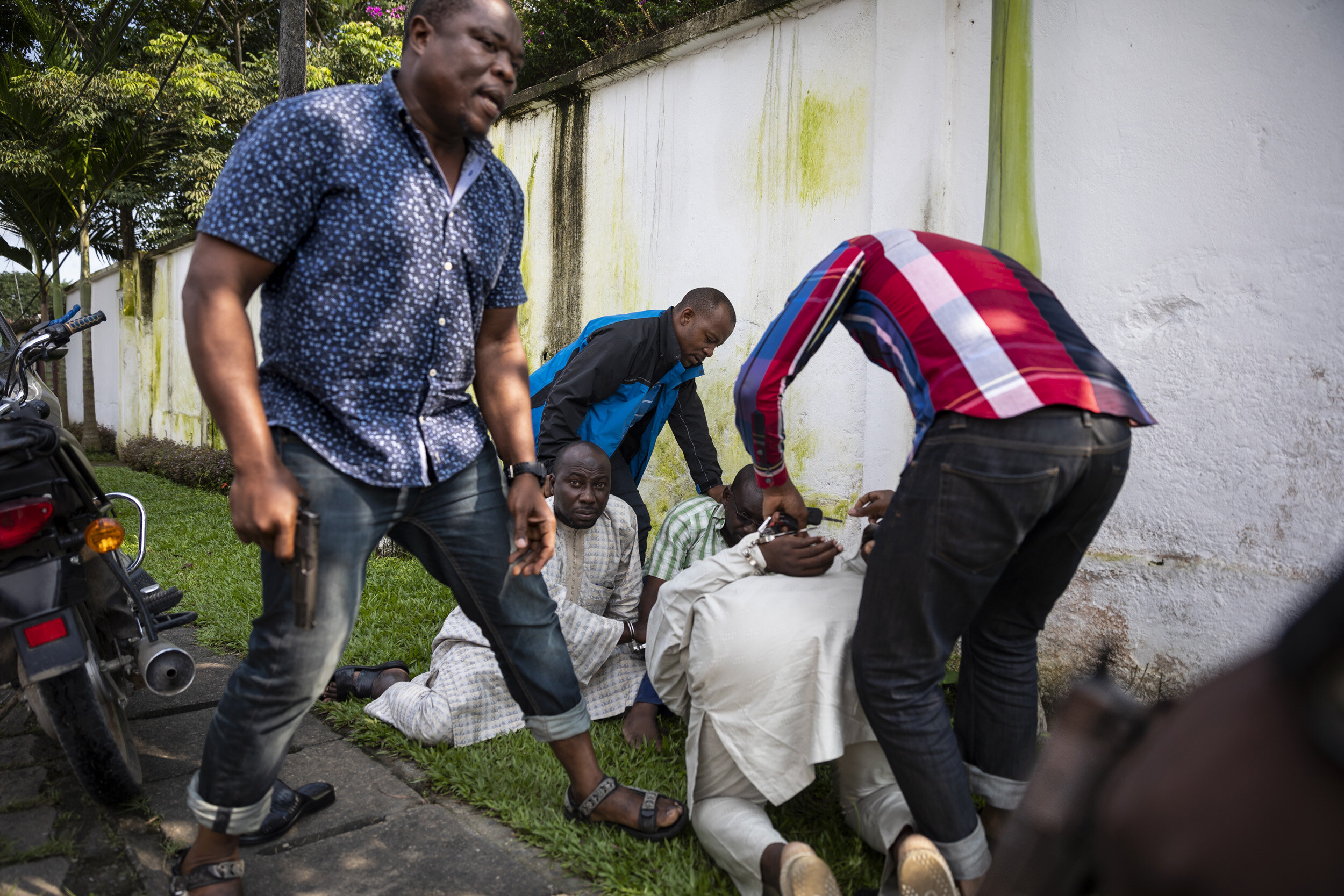 DOUALA, CAMEROON, 18 AUGUST 2018: Members of the Ministry of Wildlife, undercover Police and undercover members of LAGA, a wildlife law enforcement agency capture a group of 5 men who tried to sell one thousand kilograms of giant pangolin scales to