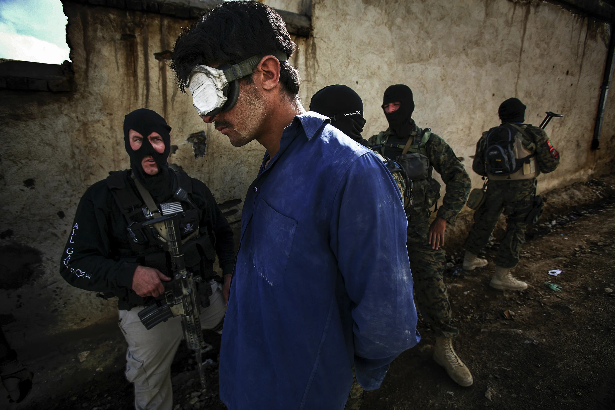 KABUL, AFGHANISTAN-APRIL 2007: Scenes from a drugs bust conducted by the Afghan Anti-Narcotics unit assisted by American DEA agents who have been training these men for over 2 years, Kabul, Afghanistan, 18 April 2007. The images show a search scene