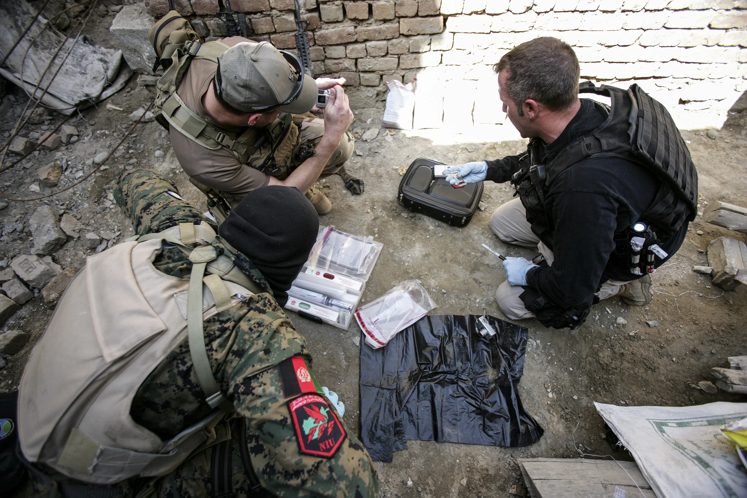 KABUL, AFGHANISTAN-APRIL 2007: Scenes from a drugs bust conducted by the Afghan Anti-Narcotics unit assisted by American DEA agents who have been training these men for over 2 years, Kabul, Afghanistan, 18 April 2007. The images show a search scene