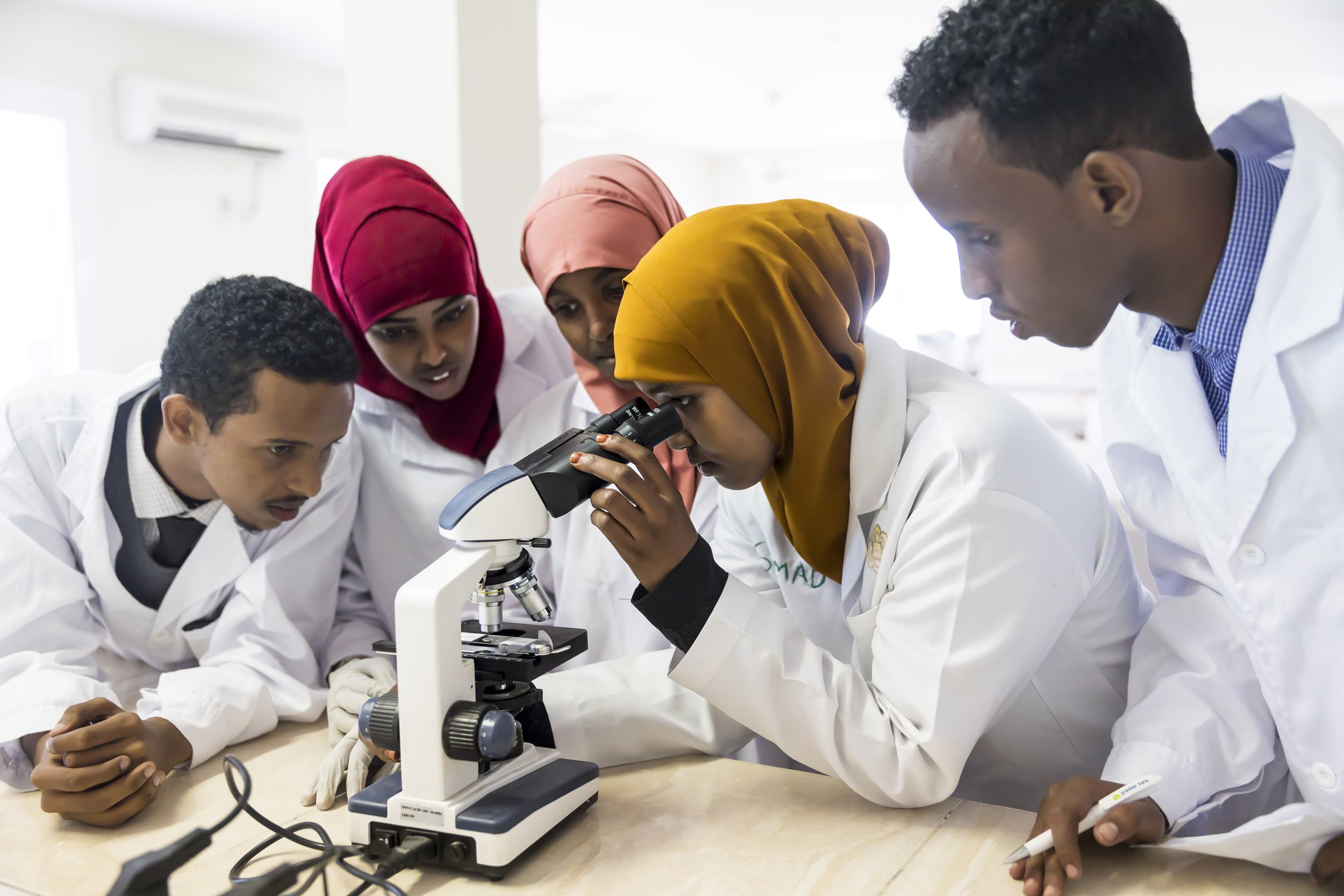 MOGADISHU, SOMALIA, 1 AUGUST 2017: Students at Simad University in Mogadishu learn lab skills in the modern laboratory in Mogadishu. The university has two labs, this one specializes in the study of hematology, micro-biology, bio-chemistry and molec