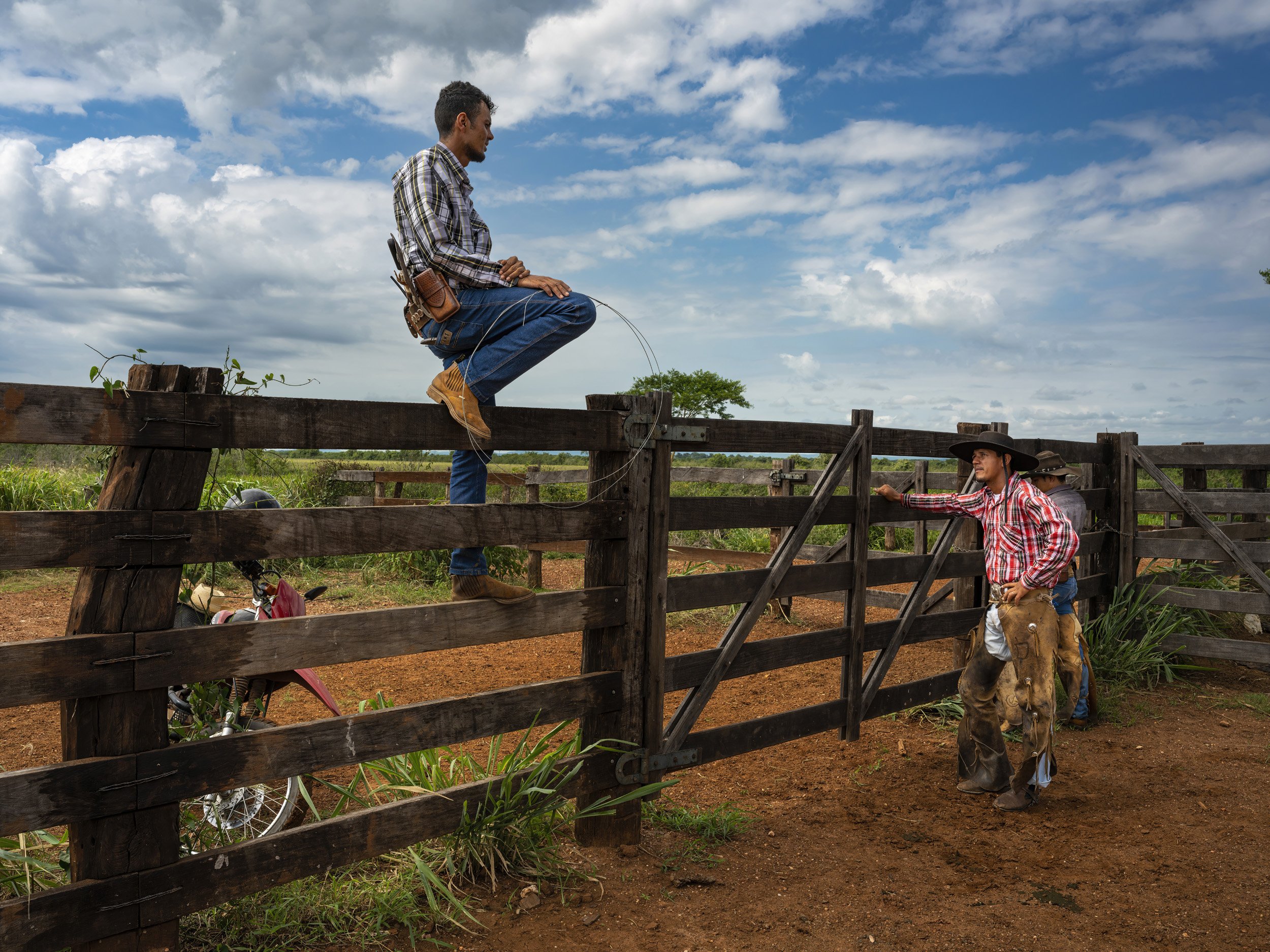 SAN FRANSCISCO FAZENDA, MIRANDA, MATTO GROSSO DU SUL, BRAZIL: Cowboys relax after moving a large herd of cattle to higher ground on the San Franciscio Fazenda, an unusual ranch that has ecotourism, cattle ranching and crop growing all in one place.
